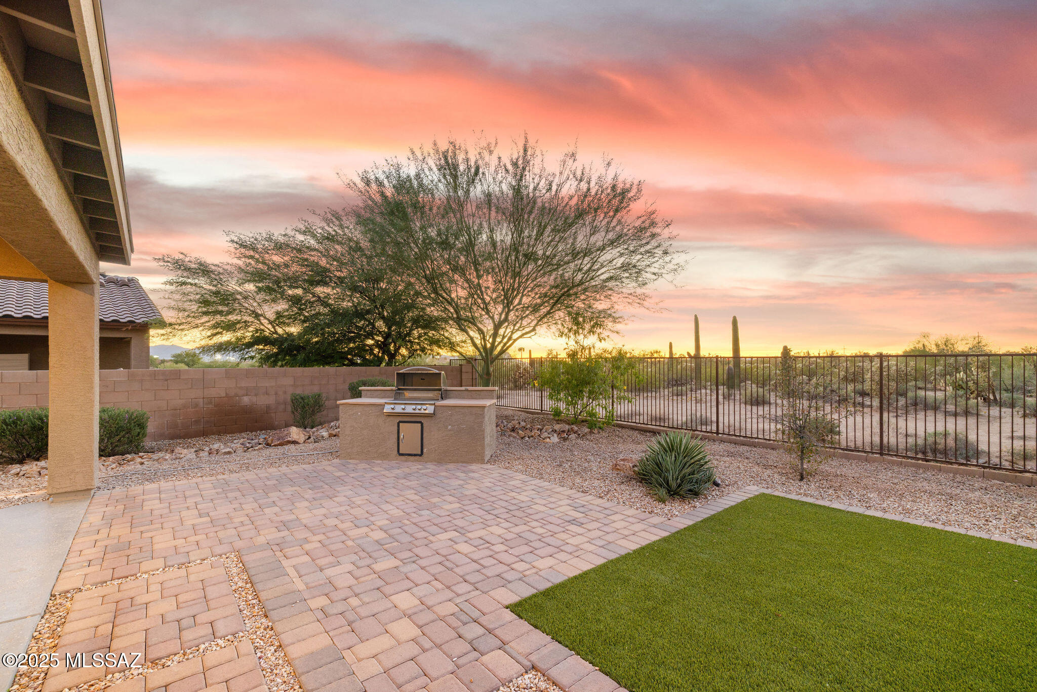 Experience the best of Northwest Tucson living in this stunning former Lennar model home, where designer details, refined craftsmanship, and thoughtful functionality meet. Perfectly maintained and completely move-in ready, this residence showcases the quality and attention to detail only found in a builder's showcase property.Step inside to find elegant finishes, stylish accents, and open-concept living spaces bathed in natural light. The home's Next Gen design offers exceptional flexibility, ideal for multi-generational living, extended guests, or a private work-from-home suite. Whether you're hosting, relaxing, or creating a separate retreat, every square foot has been designed for modern comfort and connection. Out back, enjoy your own private desert sanctuary. The property backs onto a peaceful greenbelt, offering beautiful natural views and enhanced privacy rarely found in suburban living. Morning coffee or sunset gatherings on the patio feel miles away from the bustle   yet you're minutes from shopping, dining, and all the best that Tucson's Northwest corridor has to offer. With model-home polish, move-in-ready convenience, and versatile living for today's lifestyles, this home truly stands apart. Discover why this is more than just a home   it's a next-level Tucson lifestyle.