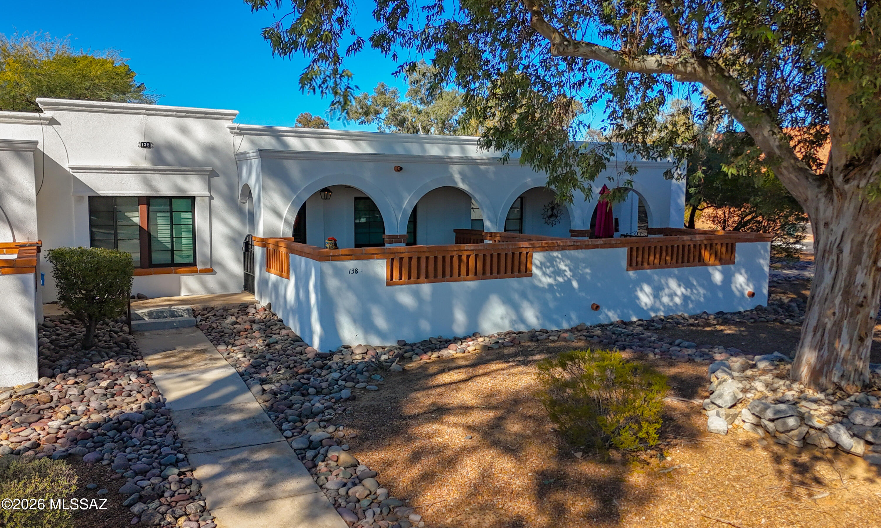 Experience the best of Green Valley and GVR from this centrally located villa with beautiful mountain views. Enjoy the convenience of being within walking distance to shopping and restaurants. This well-maintained home includes a washer and dryer and features updated countertops, full-size stainless steel appliances, newer wallpaper, recessed kitchen lighting, double-pane windows, a new bathtub and surround, no popcorn ceilings, and neutral tones throughout. Relax and soak up the Arizona sunshine from your private front patio. GVR membership offers access to heated pools, a fitness center, activities, and more. Golf is just down the street. A must-see home!
