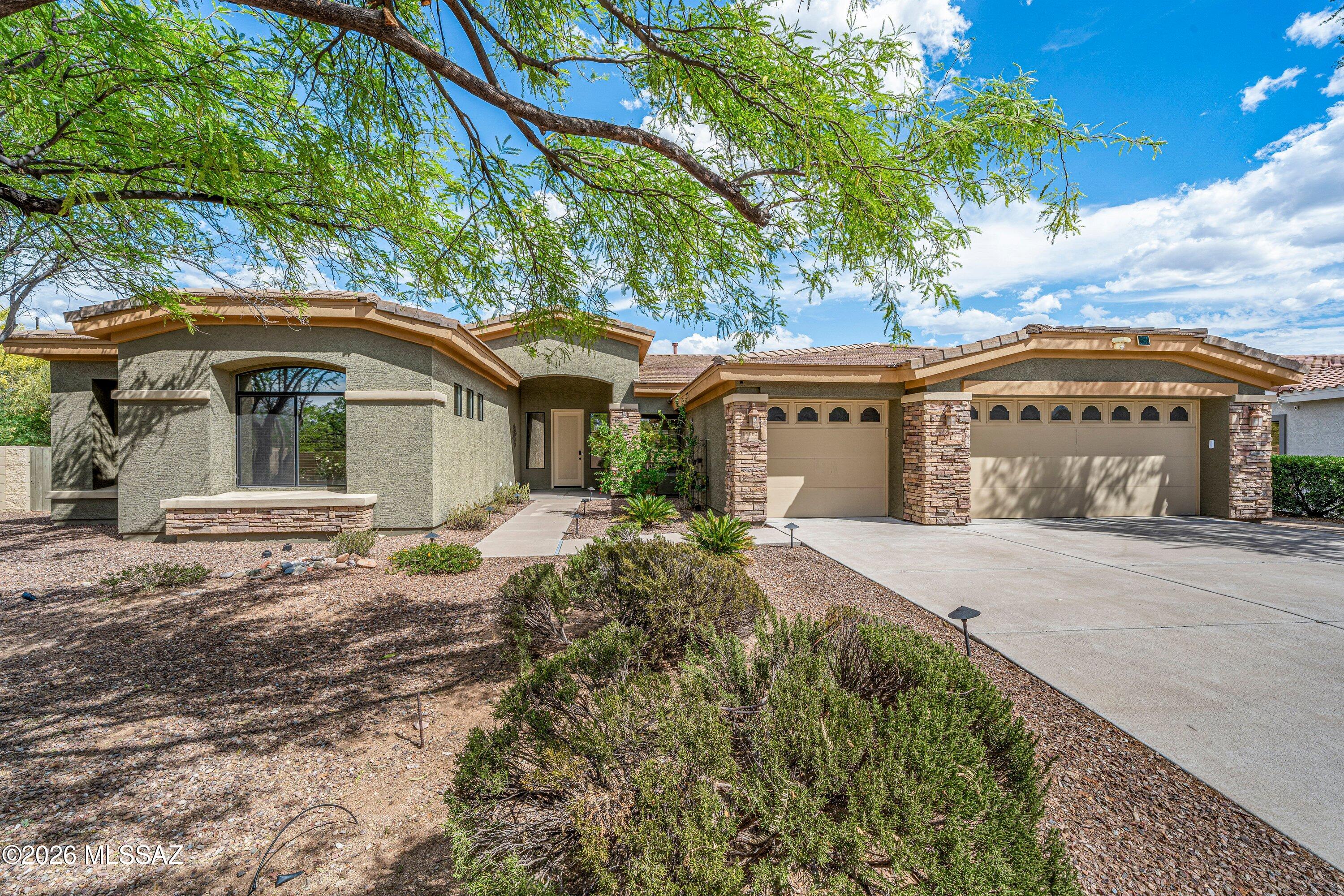 Wake up to breathtaking Catalina Mountain sunrises from this contemporary cul-de-sac retreat in Oro Valley. Designed for effortless desert living, oversized windows frame unobstructed views while the open layout flows seamlessly from a gourmet kitchen into an inviting great room with fireplace and patio access.

Exterior has been freshly painted; please note updated color scheme.  The ultimate backyard experience--featuring a sparkling pool and spa with a brand-new heater, freshly cleaned, drained, and filled with crystal-blue water. Enjoy mature fruit trees, blooming roses, and multiple covered and open patio spaces designed for relaxing or entertaining against a stunning mountain backdrop. A private split layout, flexible living spaces, and a 3-car garage complete the package--offering comfort, style, and an elevated lifestyle in Oro Valley.