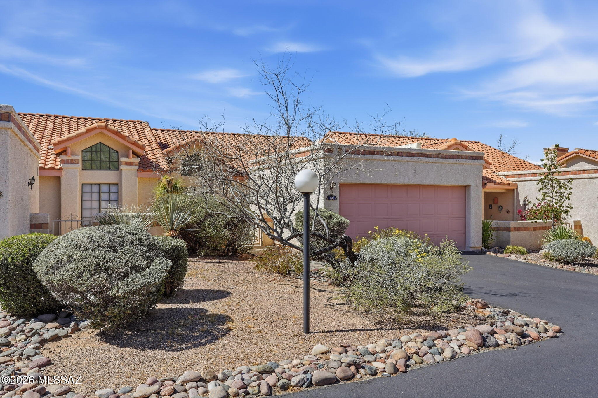Charming TH tucked in back of desirable Horizon Heights! Serene lot backs to natural desert offering privacy & peaceful surroundings. Perfectly positioned to take in breathtaking AZ sunsets w/sweeping views all the way to the Tortolita Mtns. Quaint courtyard entry welcomes you into an open plan featuring a spacious great room w/tons of windows, cozy FP & newer laminate flooring. Open kitchen serves as the heart of the home w/SS appliances, closet pantry, conv breakfast bar, abundant cabinetry & counter space. Kitchen nook includes slider to courtyard-perfect for enjoying a cool breeze or sipping morning coffee in the sunshine. Good-sized spare room w/lots of light. Private primary offers lg walk-in closet, dual vanity & walk-in shower creating a comfortable & relaxing desert retreat! Beautifully maintained & quiet, this community features a pool, spa, & rec center & is conveniently located near some of Tucson's finest golf, shopping, parks, schools & dining.