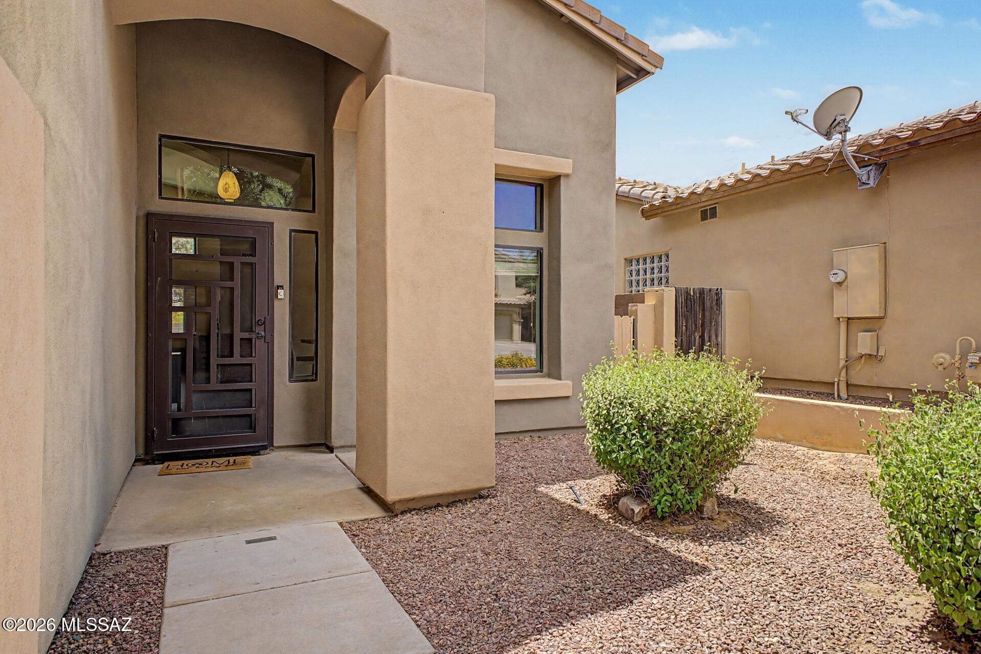 Beautiful 3-bedroom home in the highly sought-after Rancho Sahuarita community! Features a spacious 3-car garage and upgrades including new energy-efficient windows. Bright and open floor plan with vaulted ceilings, a cozy fireplace, and great natural light throughout. Kitchen offers plenty of additional cabinetry and opens to a comfortable family room. Upstairs includes a versatile loft and plush carpet throughout the stairwell and second level. Spacious backyard with covered patio--perfect for relaxing or entertaining. Enjoy access to parks, pools, walking paths, and activities for all ages. A great home in a community that truly has it all!