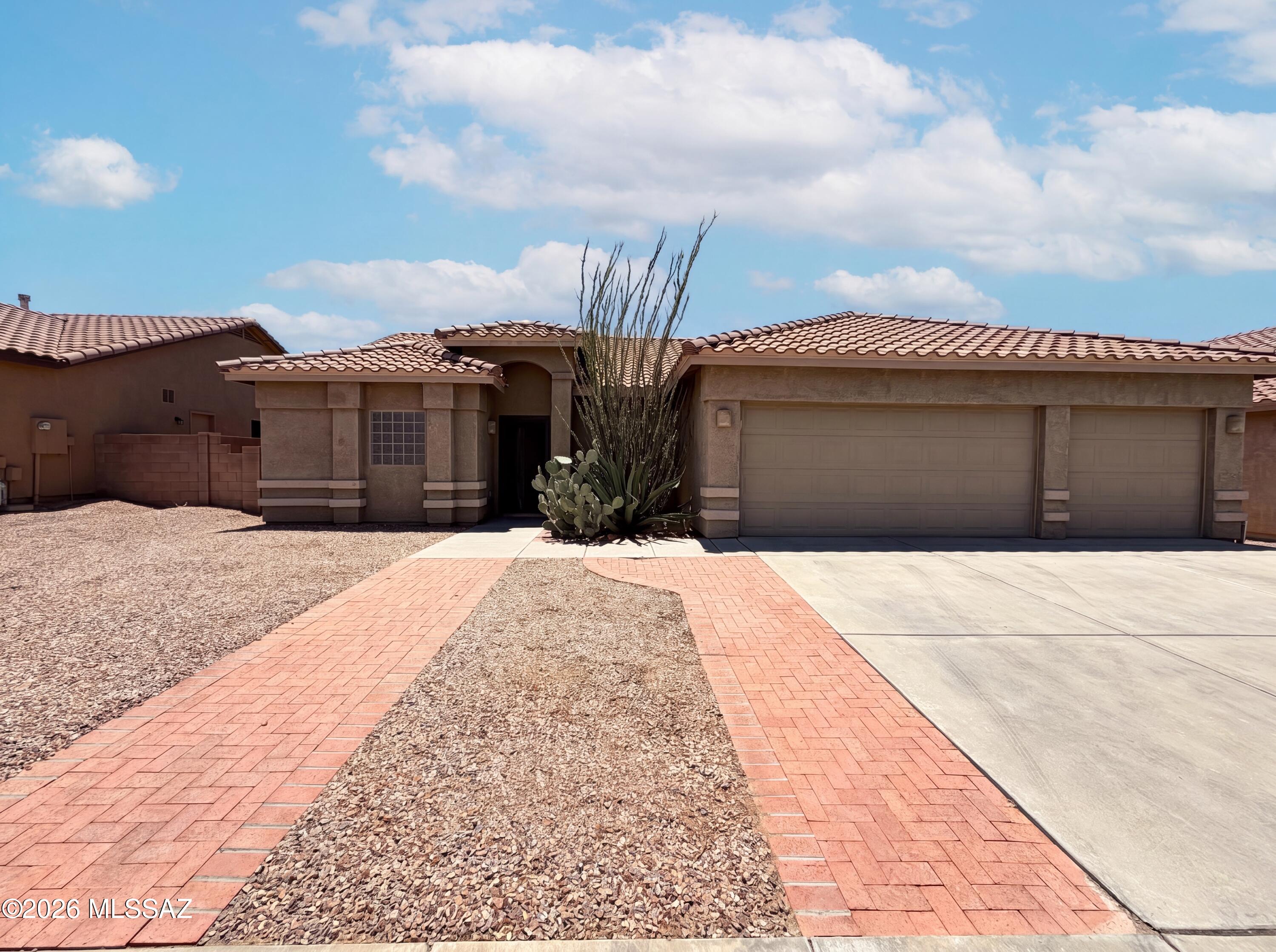 Picture yourself at 5225 W Wild Burro Spring Dr, a residence recently improved with fresh interior paint and a partial flooring replacement providing an appealing refresh. Inside, the kitchen includes all stainless steel appliances, while outside, a covered patio and a fenced in backyard complete the functional exterior space. This updated property is ready for comfortable living, inside and out.. Included 100-Day Home Warranty with buyer activation