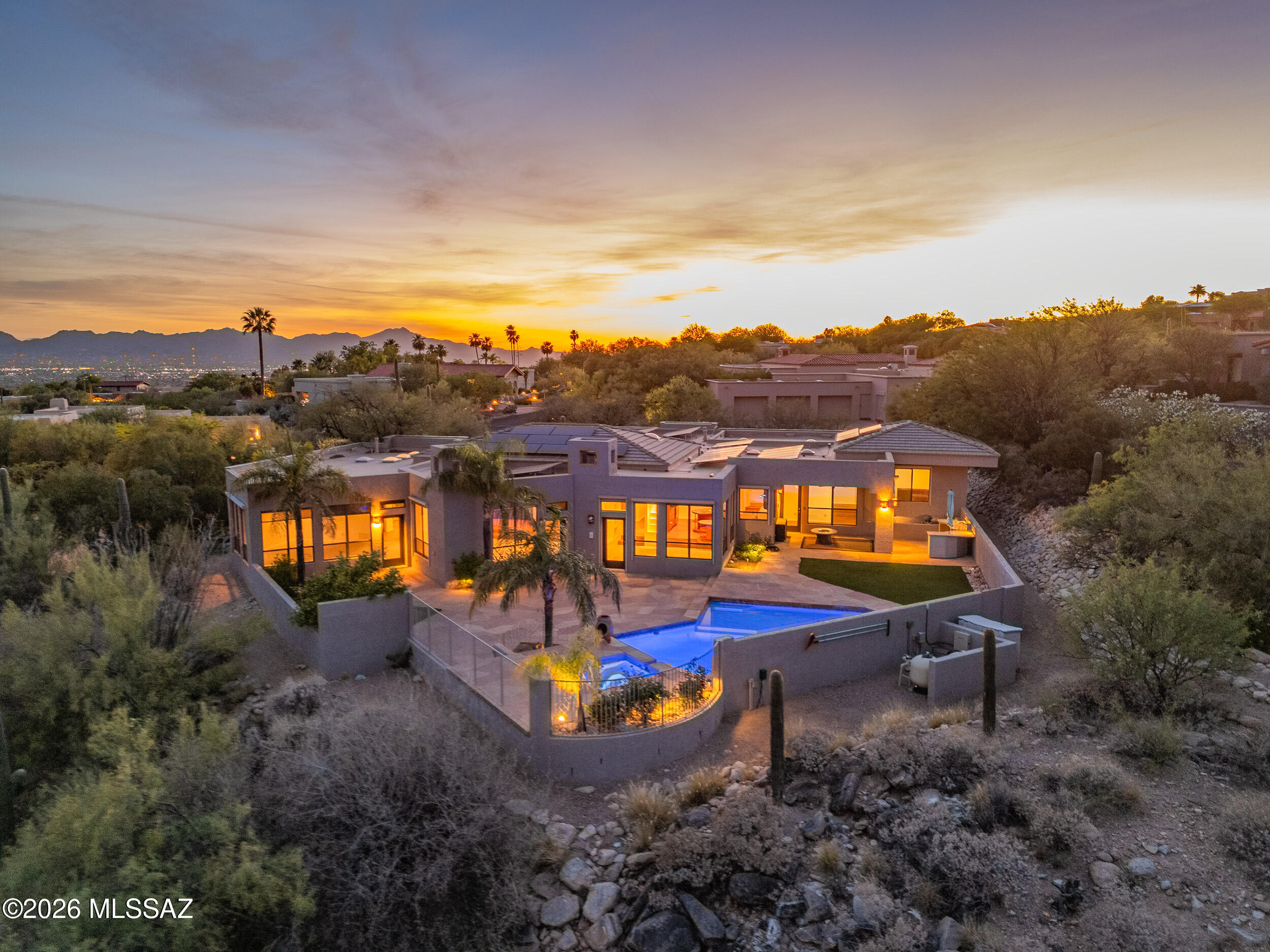 Privately positioned at the end of a quiet cul-de-sac within the prestigious guard-gated Cobblestone community, this distinguished 4-bedroom, 3.5-bath residence offers just under 4,000 square feet of thoughtfully curated living space on an expansive .86-acre lot. The sense of seclusion here is rare and deliberate, a true sanctuary that remains effortlessly connected to the finest that Tucson has to offer.

Inside, a well-appointed split floorplan strikes an elegant balance between intimate comfort and gracious entertaining. Generously proportioned living areas flow with ease and intention, while a comprehensive refresh including brand-new paint, plush new carpeting, updated outlets, and high-end light fixtures throughout ensures the home presents with a polished, move-in-ready sophistication from the moment you arrive.

The kitchen stands as a compelling opportunity for the discerning buyer: a pristine canvas awaiting a bespoke transformation tailored entirely to your culinary vision and aesthetic sensibilities.

The northeast-facing backyard is nothing short of extraordinary. Sweeping mountain views and soft city light vistas frame a resort-caliber outdoor experience, anchored by a sparkling pool and spa. A tranquil nature path just beyond the property invites quiet morning walks and unhurried evening strolls, while a dedicated viewing bench offers an ideal vantage point to absorb the surrounding landscape and wildlife in complete serenity.

The home's infrastructure is equally impressive. A spacious 3-car garage, central vacuum system, electric rolling shutter screens, and a whole-home soft water system speak to a standard of living that prioritizes both convenience and quality. The HVAC systems have been meticulously maintained through consistent semi-annual servicing, and a 3-year-old leased solar system, transferable to the new owner, delivers meaningful reductions in monthly energy costs alongside the added assurance of a 10-year roof warranty.

Refined, private, and rich with possibility, this exceptional property represents a rare opportunity to own an elevated lifestyle within one of Tucson's most coveted gated communities.