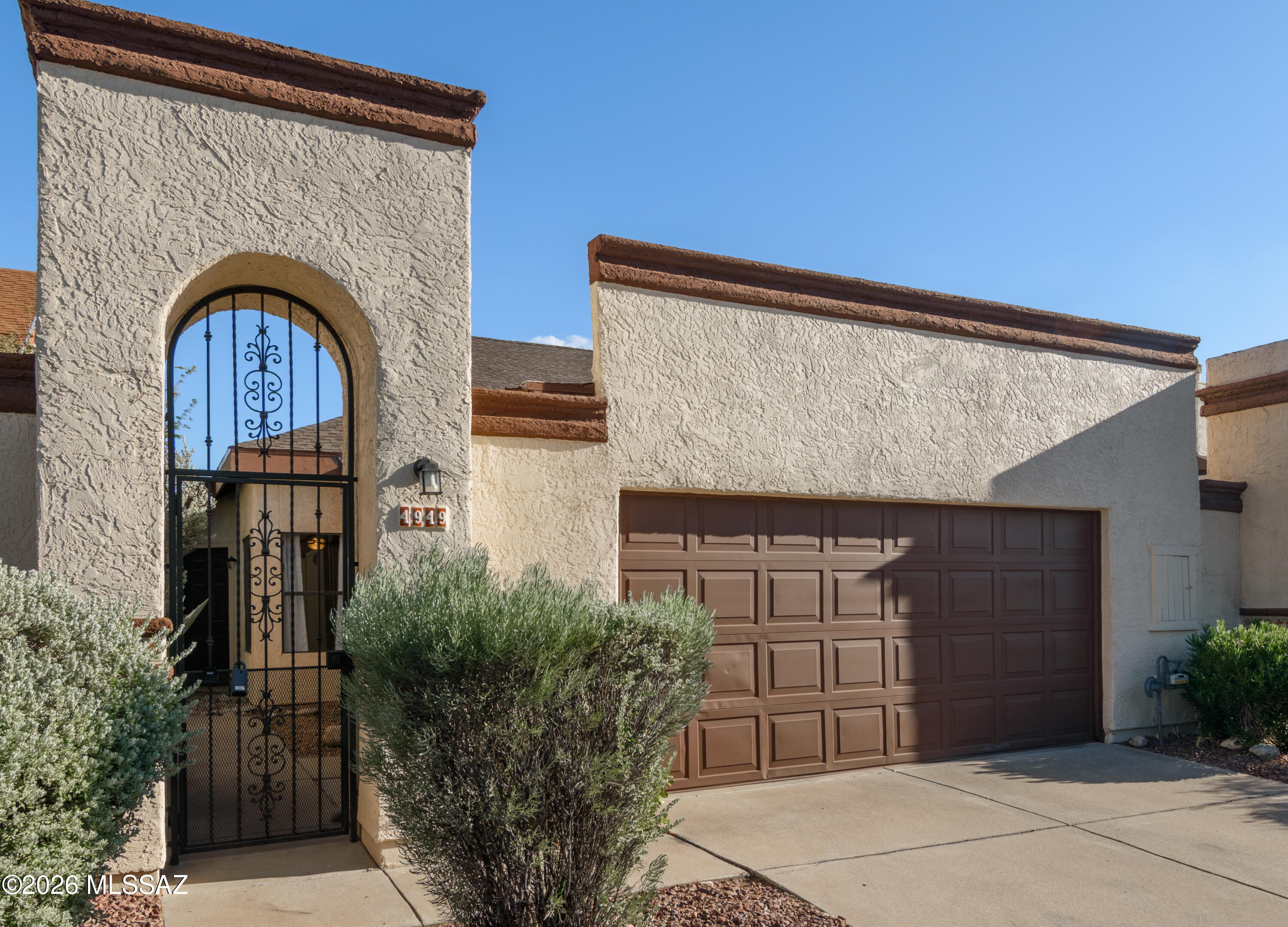 Freshly painted throughout and featuring brand-new carpet, this functional two-story Marana home is completely move-in ready while offering great potential to customize over time. The thoughtful layout dedicates the entire second floor to a private primary suite, leaving the main level open for daily living, the remaining bedrooms, and full bath. Smart storage solutions include a kitchen pantry and an extra closet tucked under the stairwell. Uniquely for a townhouse, this property sits on a 0.074-acre lot boasting a covered patio and a remarkably large yard backing to the desert--perfect for pets, gardening, or relaxing. Complete with an attached 2-car garage (converted from a carport), this home delivers practical spaces and great outdoor living in a prime location.