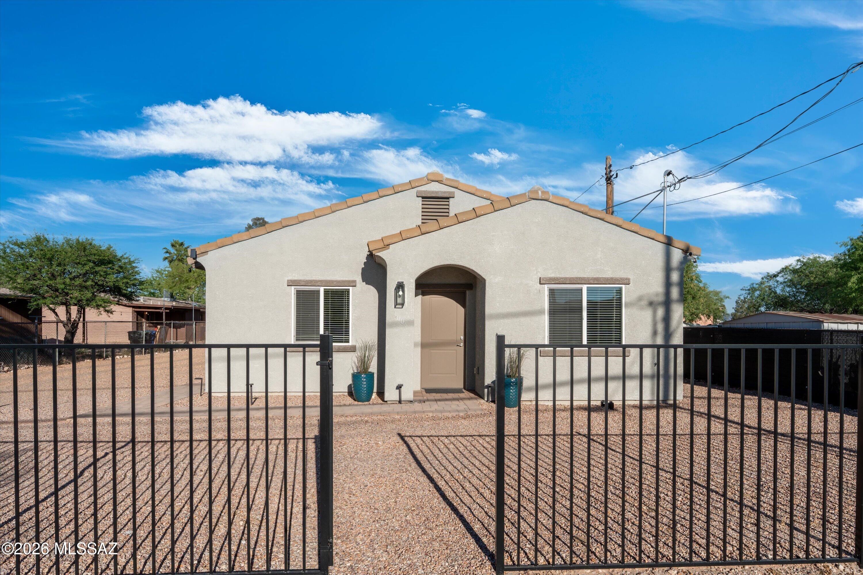 A beautifully built 2-year old modern home offering the perfect blend of style, comfort, and convenience in the heart of Tucson. Ideally located minutes from downtown, the University of Arizona, vibrant local dining and entertainment, this home also enjoys close proximity to a newly renovated park?perfect for outdoor recreation and relaxation. A thoughtfully designed 3-bedroom, 2-bath residence features a bright open layout with clean lines, contemporary finishes, and abundant natural light throughout. The kitchen offers sleek cabinetry, ample storage, and functional workspace?ideal for both everyday living and entertaining. The spacious bedrooms provide flexibility for guests, a home office, or a private retreat, while the primary suite offers comfort and modern appeal. A generously sized yard with endless potential to create your own desert oasis.