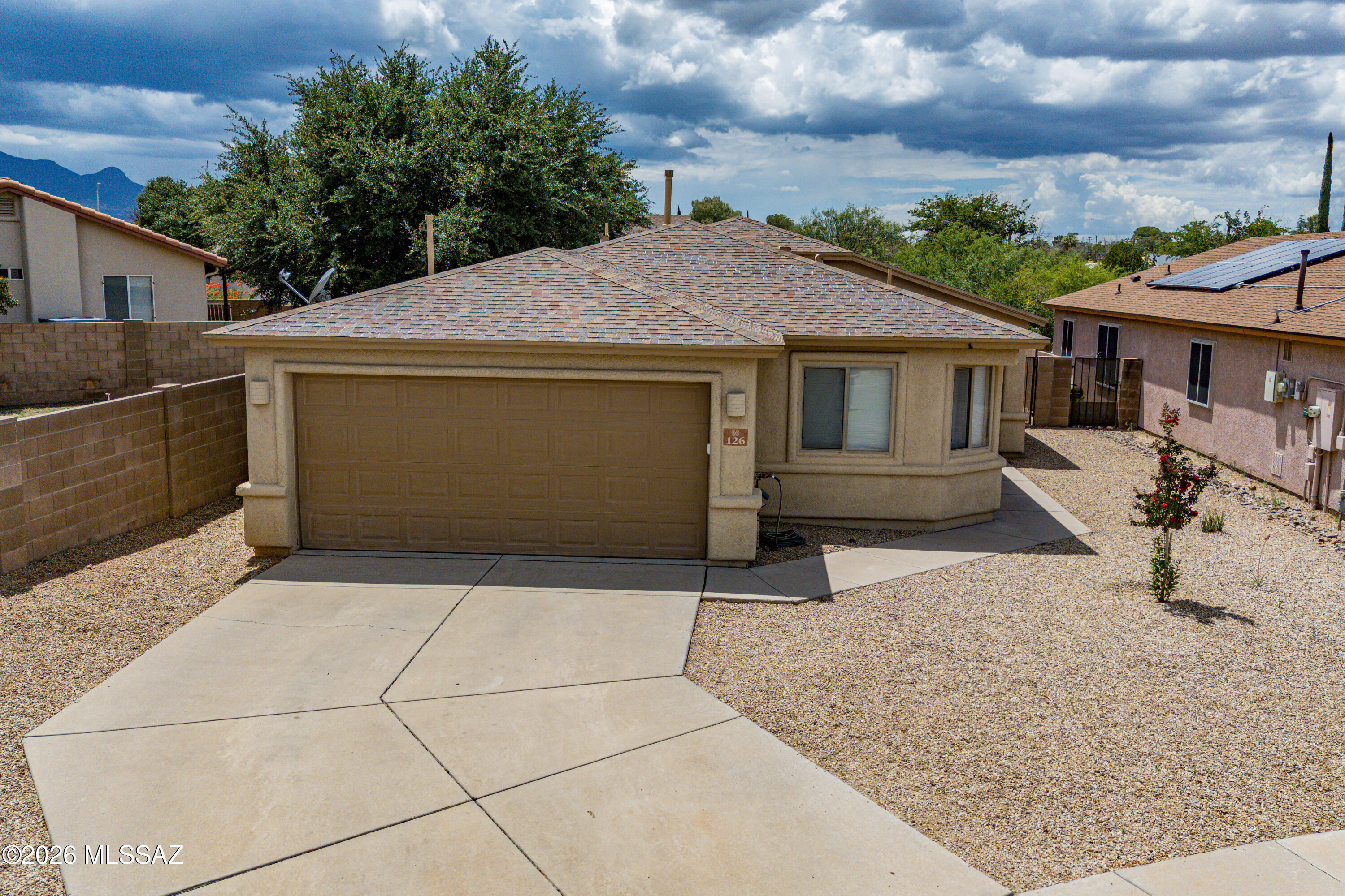 This beautiful 4-bedroom, 2-bathroom home offers a spacious open-concept floor plan with a large great room that's perfect for everyday living and entertaining. Brand New carpet in 3 of the bedrooms. The kitchen features elegant granite countertops, stainless steel appliances, and ample space for meal preparation and gathering. Step outside to enjoy the backyard, complete with a ramada, a built-in BBQ grill, and a storage shed, a dog run?ideal for outdoor entertaining and extra storage. Attached 2-car garage.