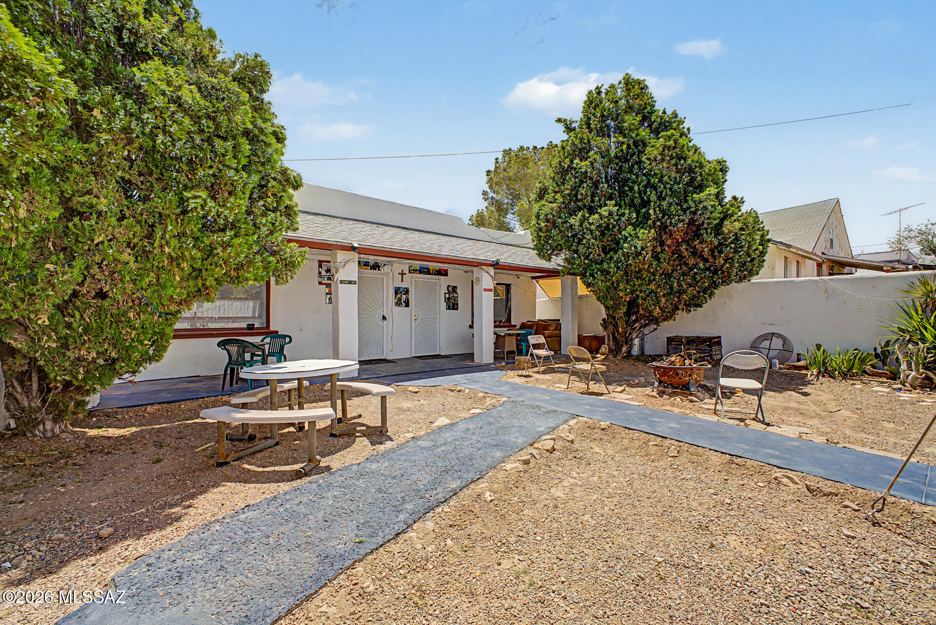 Income property in the Heart of Tombstone! 3 separate units or two units and a owners living quarters or three living spaces for you and your loved ones. New carport with enclosed garage, renovated living spaces and walking distance to the Historic Allen St. in Tombstone Arizona. Fully fenced and secure, the lot is very useable and groomed. Street parking for guests , with gated/covered parking under the carport.  Lower unit accomodates larger groups of people while the top unit has fully renovated kitchen and patio.