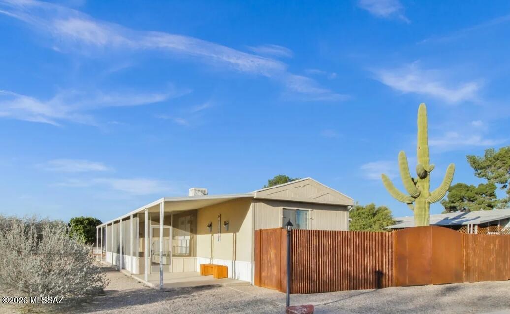 Beautiful 3-bedroom, 2-bath home on a spacious corner lot in the desirable Orange Grove Mobile Estates in NW Tucson. This well-designed home features a split-bedroom layout and an open floorplan, creating a comfortable and functional living space. The kitchen offers ample cabinet storage and generous counter space. Enjoy the large screened-in front porch, perfect for relaxing. The fully fenced backyard includes an extended covered carport and a storage shed for added convenience. Community amenities include a pool, spa, basketball court, playground, and clubhouse. Conveniently located near I-10, shopping, dining, and the Northwest Medical Complex.