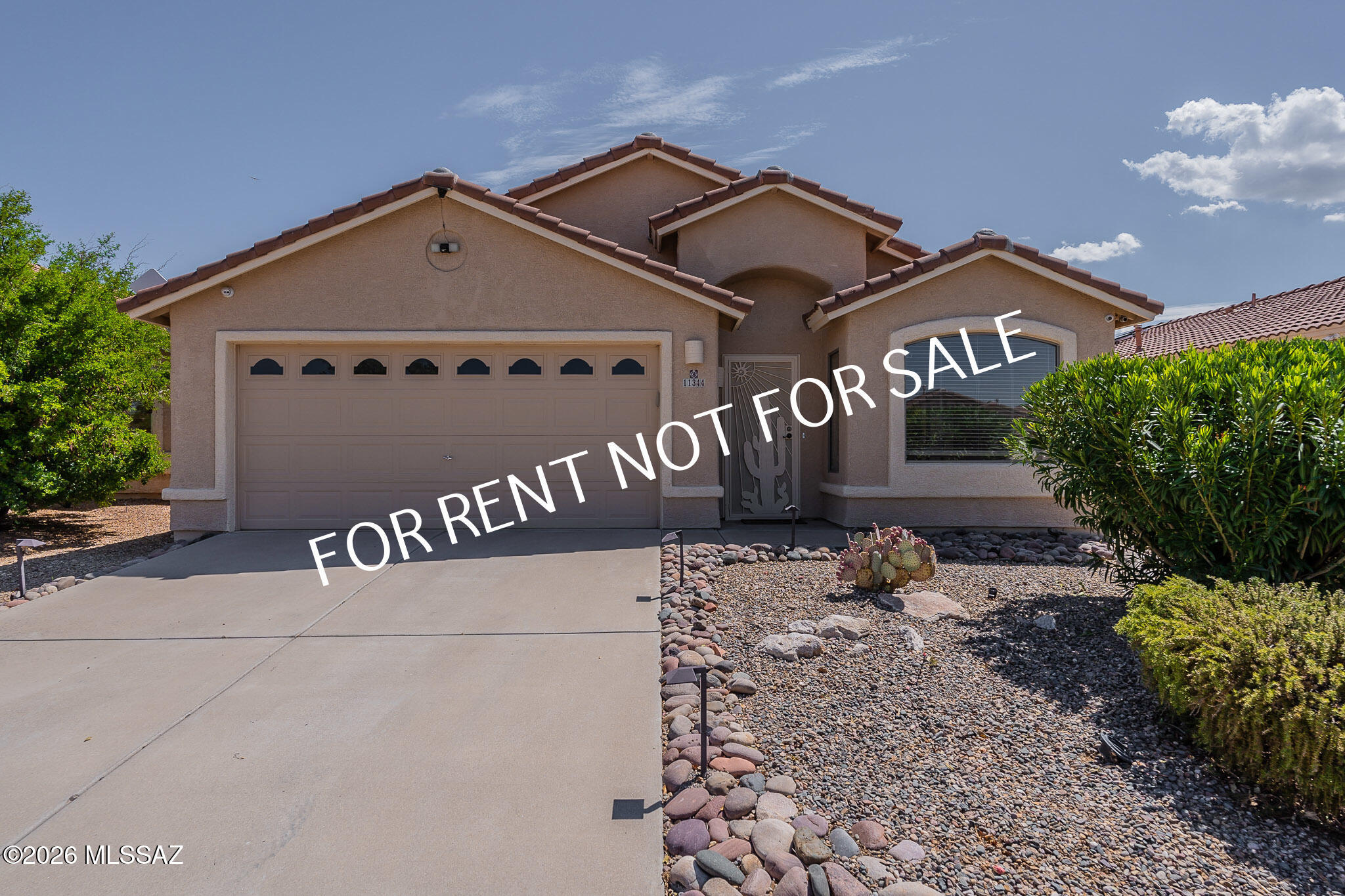 AVAILABLE 06/29/2026 - Built in 2000 - 4BED 2 BATH - 1873 SQ.FT. of comfortable living space in the desirable Rams Canyon at La Reserve community. This light and bright open-concept home features a spectacular backyard designed for entertaining, complete with a sparkling PebbleTec pool, putting green, outdoor kitchen, built-in grill, refrigerator, and breathtaking views of Pusch Ridge. Fresh, plush new carpeting throughout. The home includes formal living and dining areas, as well as an updated kitchen equipped with a refrigerator, stove/oven, microwave, dishwasher, and a cozy breakfast nook adjacent to the family room. Additional features include a laundry room with washer and dryer, a spacious garage with built-in storage cabinets, and an extra refrigerator provided in ''As-Is'' conditio