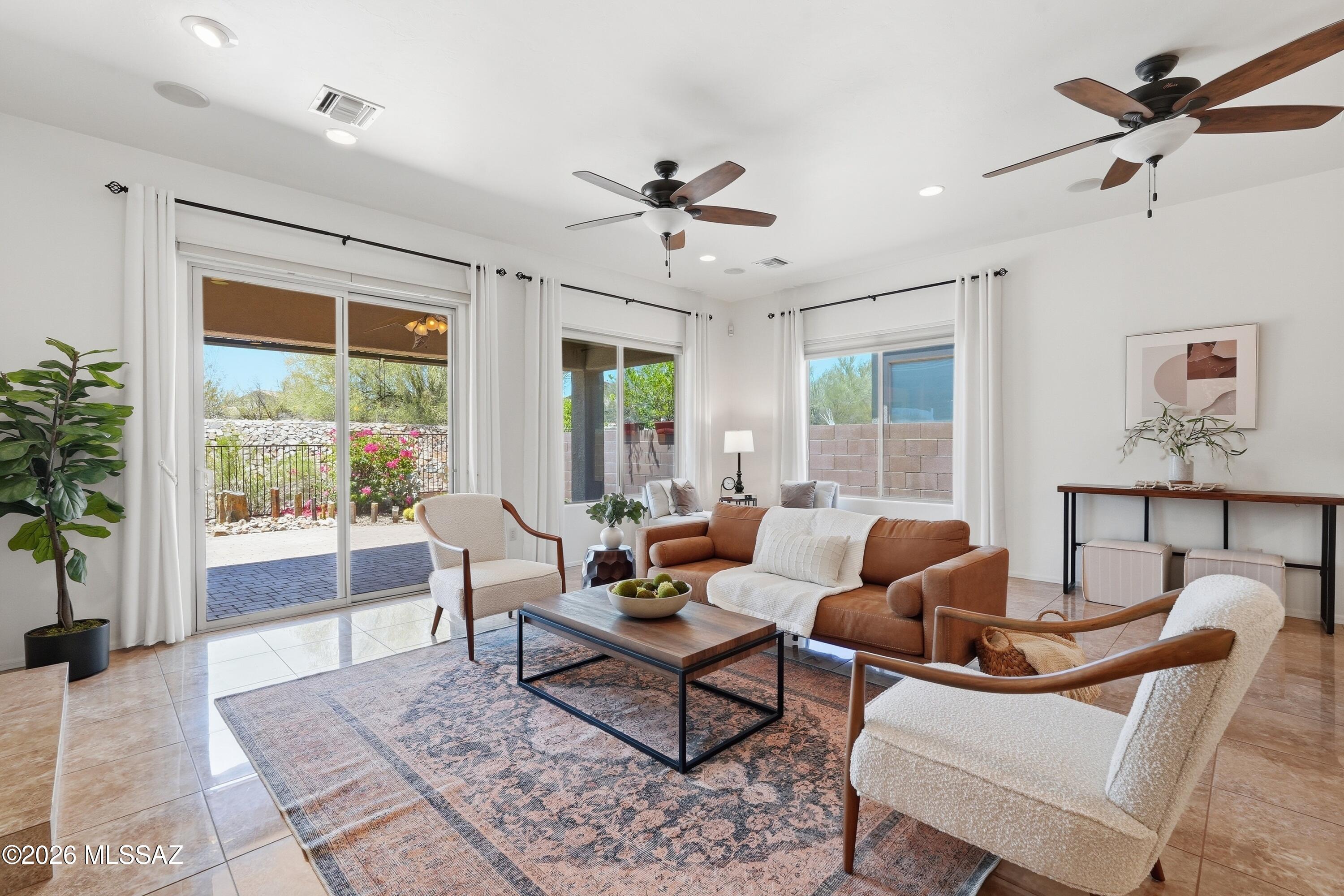 Incredible Opportunity in the GATED Preserve of Dove Mountain - Immaculate gem on a quiet cul-de-sac. The open-concept layout stuns with 12-ft ceilings, custom flooring, surround sound, and a grand great room anchored by a gas fireplace. Gourmet kitchen impresses & massive quartz island, stainless gas appliances, mosaic backsplash, solid wood cabinets, and a large pantry. The main retreat offers backyard access, dual vanities, soaking tub, and a walk-in closet. Step outside to a serene desert oasis with COMPLETE PRIVACY. 3-car tandem garage, Milgard windows with lifetime warranty, new water heater, and washer/dryer included. Minutes from fine dining, shopping, the Ritz-Carlton, and the legendary Jack Nicklaus 27-hole golf course. Community parks, tennis courts & walking paths. Zoned HVAC! complete the lifestyle. This one is truly special.