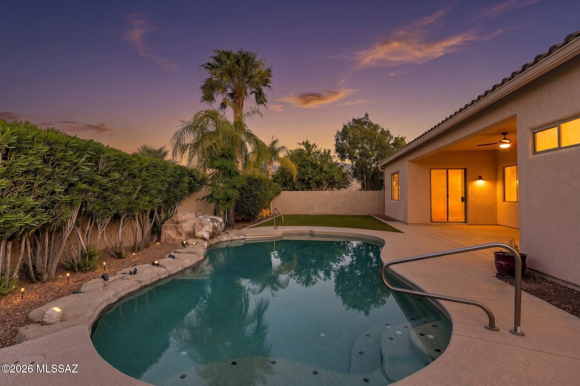 Welcome home! This spacious single-story home offers 2,842 sq. ft. of thoughtfully designed living space, featuring 4 bedrooms and 2.5 bathrooms. The open, split-bedroom floor plan is ideal for both everyday living and entertaining. The gourmet kitchen is a chef's dream with Carrara marble countertops, a custom backsplash, a Thor natural gas range with double oven, wine fridge, stainless steel appliances, and an oversized island perfect for gathering. The expansive primary suite offers patio access and a spa-like bathroom,  complete with a large walk-in closet featuring a custom organizer.  Enjoy outdoor living with a spacious covered patio, a sparkling pool, and low maintenance turf.  Ample storage is found throughout the home, along with the convenience of a three-car garage. Significant upgrades include a new roof (2019), two new AC units (2020), new pool pump (2021), new exterior paint, garage doors, and front doors (2024), and a new water heater (2026). Great location close to shopping, restaurants, golf, hiking and so much more!