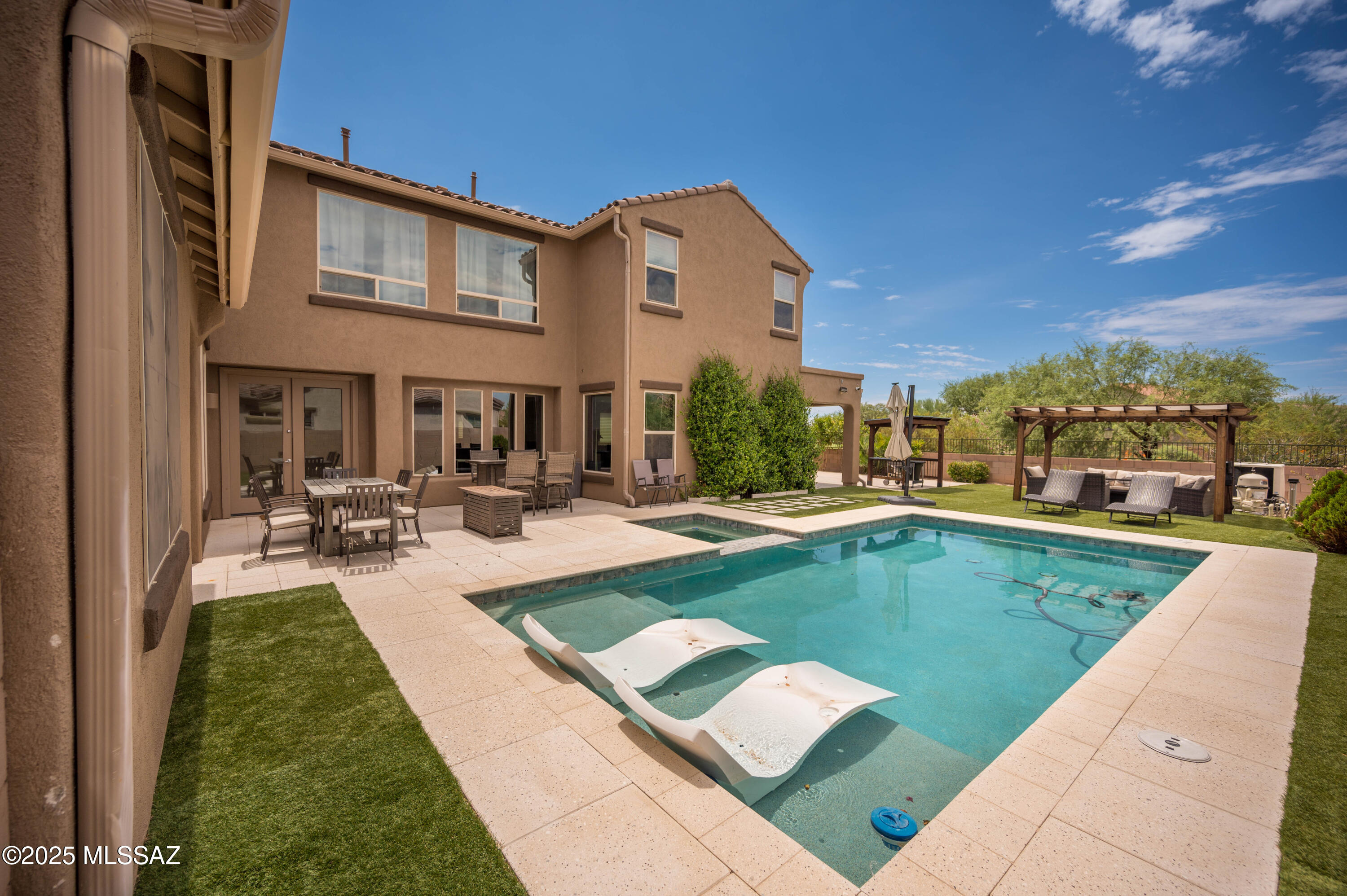 This gorgeous home is located the beautiful community of Saguaro Bloom w/trails, mountain views & community center. The floor plan is the biggest of the subdivision with formal living room, formal dining room, family room on an open concept connected to the kitchen and breakfast area. The second floor has three guest bedrooms, two guest bathrooms, open loft for more living space, and an enormous master bedroom with a spa like bathroom. The patio offers resort like amenities to enjoy the Arizona sunsets. A perfect spot for gatherings with family and friends.