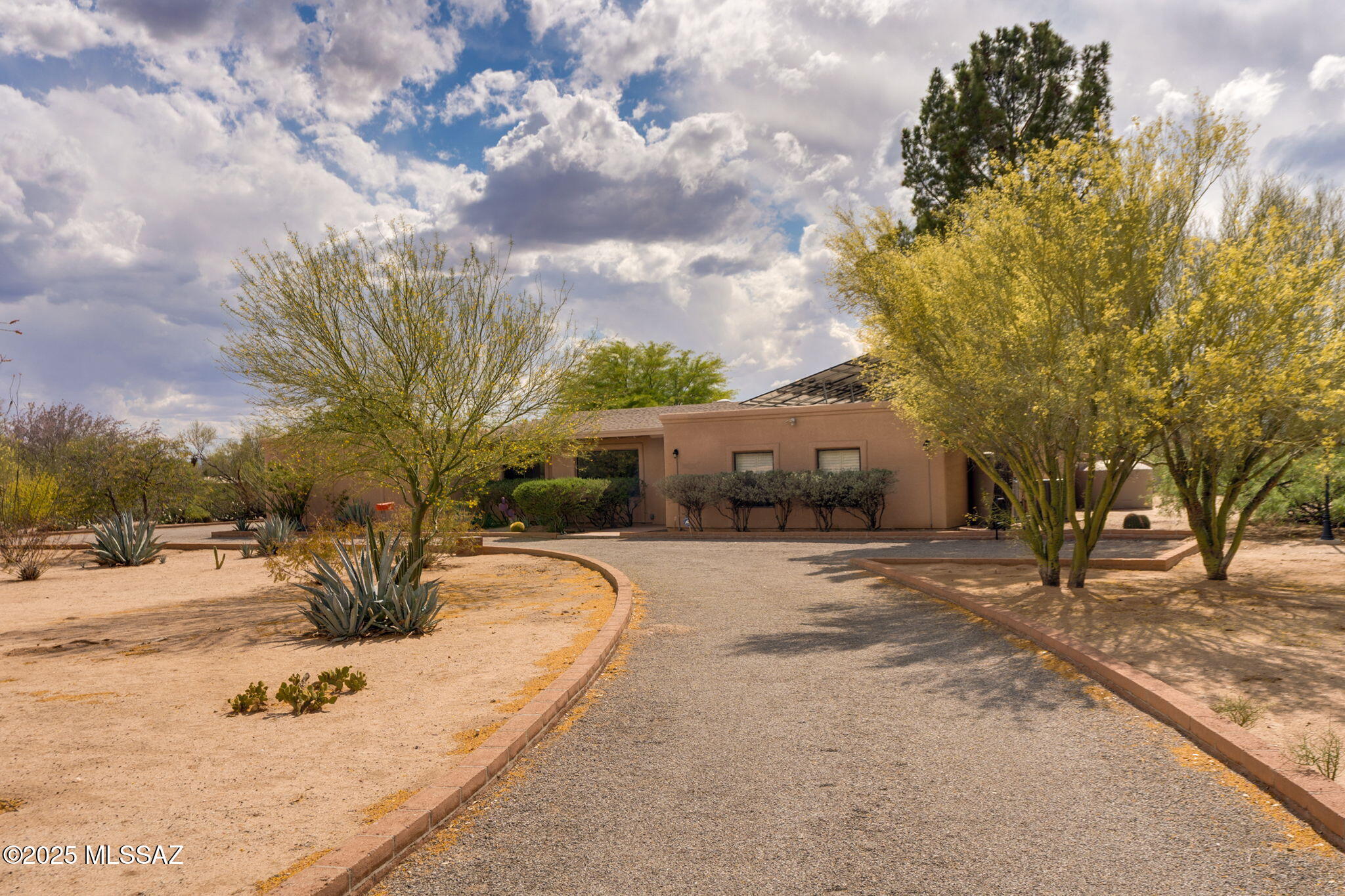 Located on a quiet cul-de-sac on 3.11 fenced acres w/stunning views of Pusch Ridge. Spacious 3,497sqft 4bed/3bath home offers perfect blend of privacy & charm + 475sqft 1bed/1bath guest house. Only minutes from shopping, dining, hiking/biking. Beautifully remodeled kitchen & primary bath, flexible living spaces includes 2nd primary suites ideal for guests, multi-gen living, or home office. Outside, the property is equipped w/seller-owned solar panels, rainwater harvesting system, running water & lighting throughout the acreage. Additional highlights include a stylish chicken coop, sm animal stable & corral, two motorized gates, circular driveway, gazebo, fruit trees & a veg garden. Rare opportunity to enjoy a serene private retreat w/modern comforts in an unbeatable location.