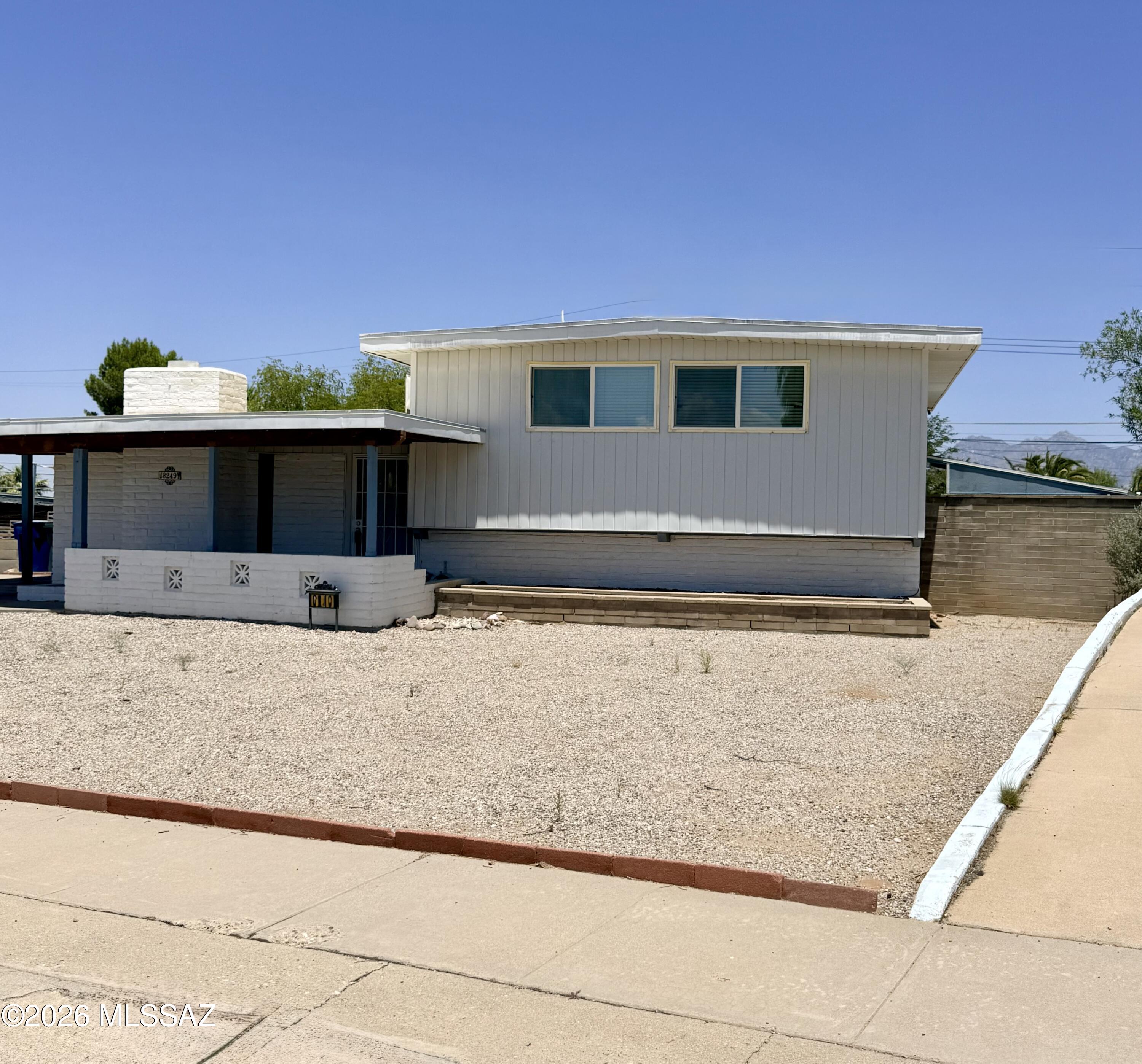 Beautiful mid century modern home! Three levels that include basement with 2 bonus rooms! Bonus rooms can be used for media, game room, office, bedroom or anything you heart desires! Basement level also includes full bathroom and large closet. Entrance level includes a beautiful living room with fireplace, dining room, kitchen, laundry room and 2nd living room with built-ins. Three bedrooms complete the upstairs along with another full bathroom in hallway and lots of closets and storage! Outside fully enclosed Arizona room leads you to insulated storage room with 2nd refrigerator. Backyard has mature trees creating shade over large backyard which is completely enclosed by brick wall and wooden gates. On the side of the yard you have additional storage with a newer shed that is included. Mountain views from backyard and so much more!!