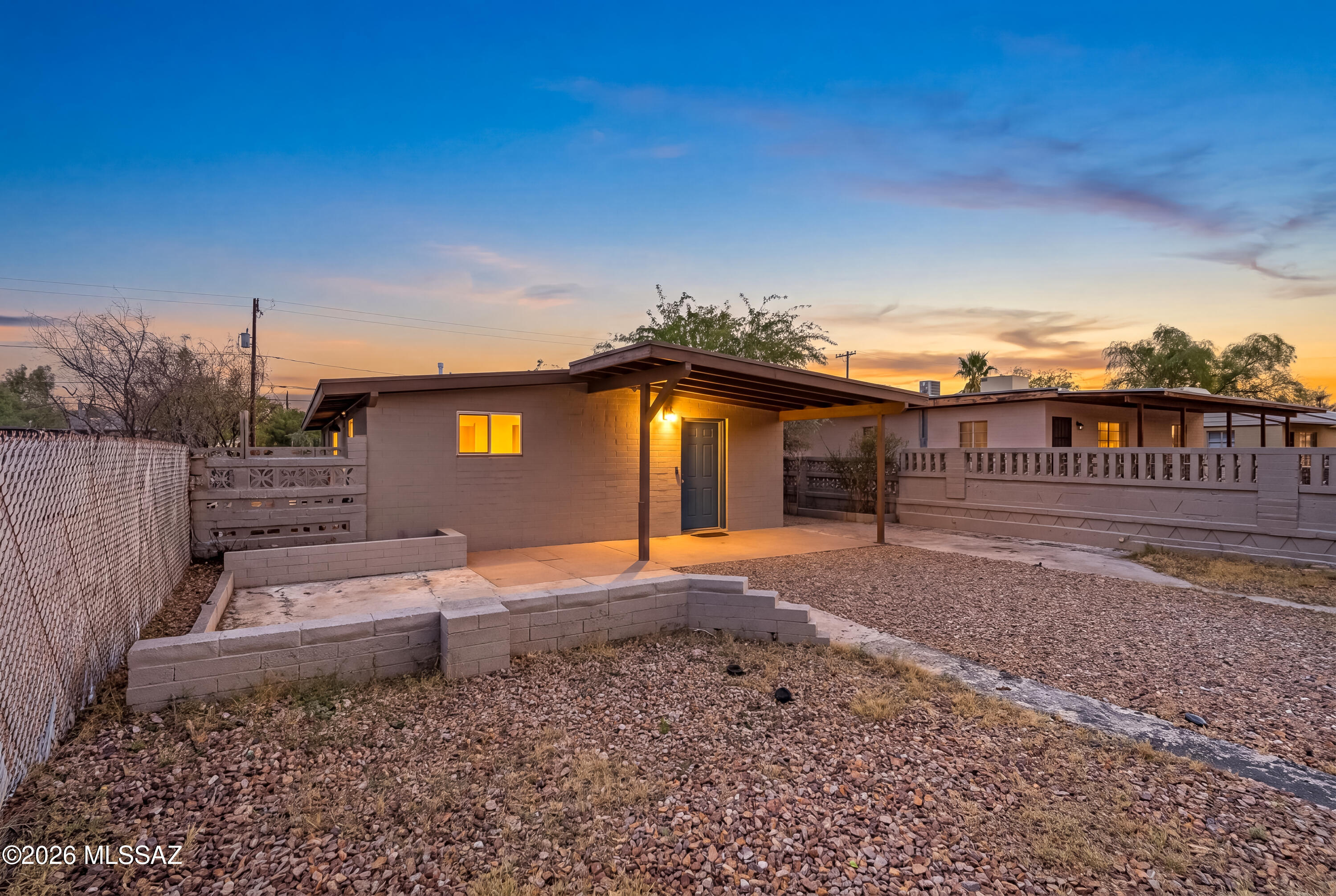 Bike to the UofA from this beautifully refreshed home! With fresh interior paint & brand-new carpet in the bedrooms, this move-in ready property features vaulted ceilings, recessed lighting & a bright, open living area. The kitchen offers stainless steel appliances, white shaker cabinetry, generous counter space, and a sunny breakfast nook with sliding glass doors leading to the backyard. The private primary suite includes its own bath, while the spacious backyard is ready for entertaining with paver patios, a storage shed, & a workshop (with electricity!). The unbeatable central Tucson location puts you minutes from the University, Banner, downtown Tucson, shopping, dining, & the new Casino Del Sol Vahí. Ideal as a primary residence, UofA student housing or a proven investment opportunit