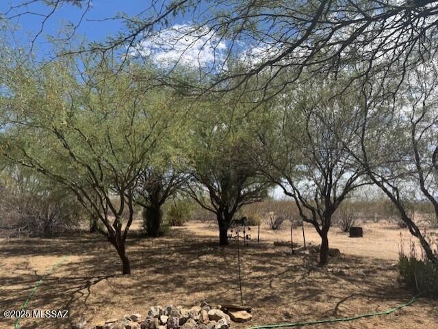 Peaceful surrounds on an 11+ acre parcel with all utilities, where you can enjoy having your horses, chickens and toys close to you instead of boarding or in a rental facility. Flat lot with a spacious Workshop with 200 amp power. Community Well Share and you sit on a corner for great access. The lot can be split or you can just use as a family compound with 2 homes. The manufactured home does convey. Lots of potential here if you are looking for a place to build a custom home or place another manufactured home. Lots of options so use your imagination!