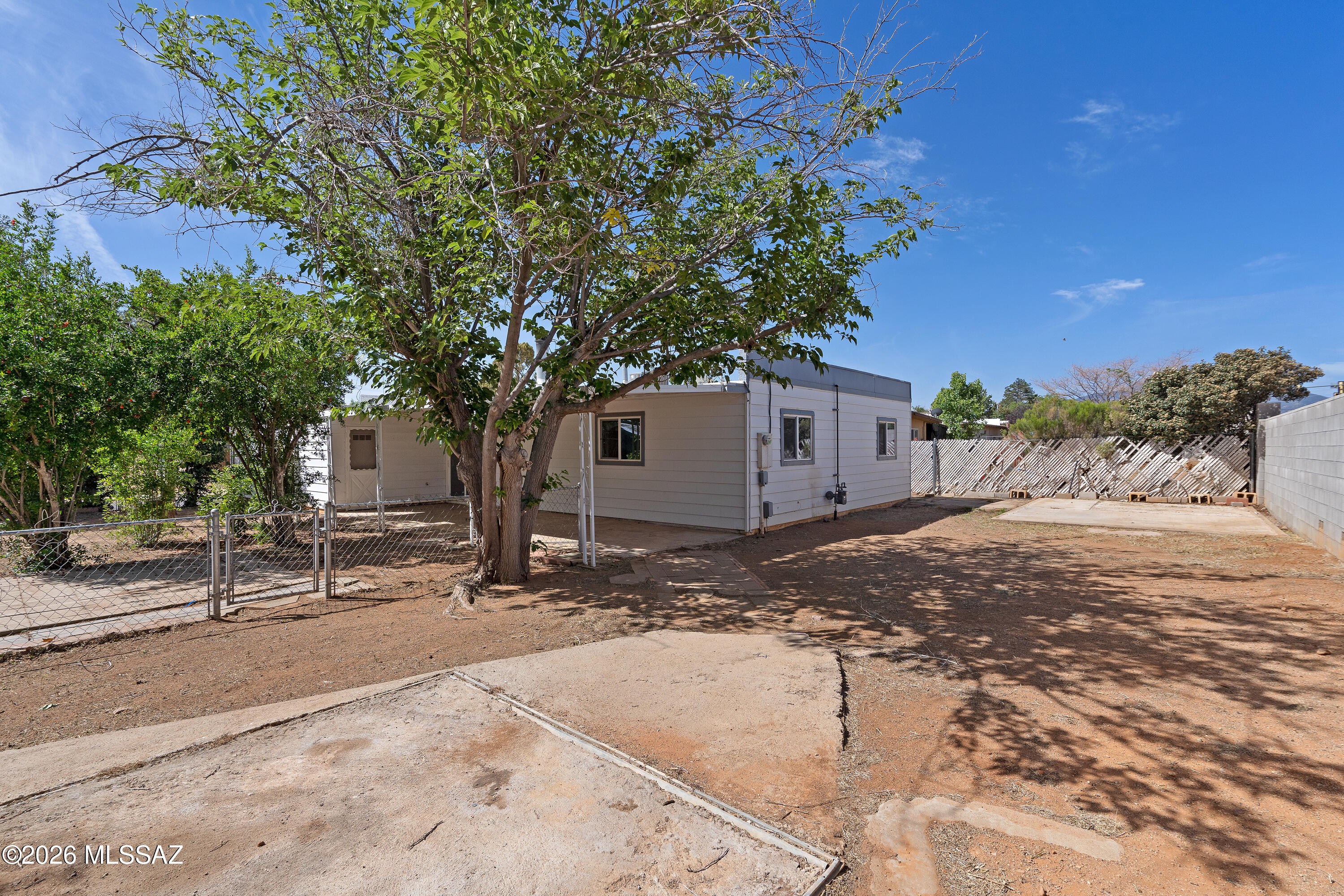 Step into this beautifully remodeled ranch-style home where modern upgrades meet timeless charm. Ideally situated in a convenient location just minutes from shopping, dining, and Cochise College, this home offers both comfort and accessibility. The stylish kitchen has been thoughtfully updated with sleek stainless-steel appliances, creating a clean, contemporary space perfect for everyday living and entertaining. The inviting living room features a striking brick-accented fireplace, adding warmth and character. Dual-pane windows throughout enhance energy efficiency and natural light.