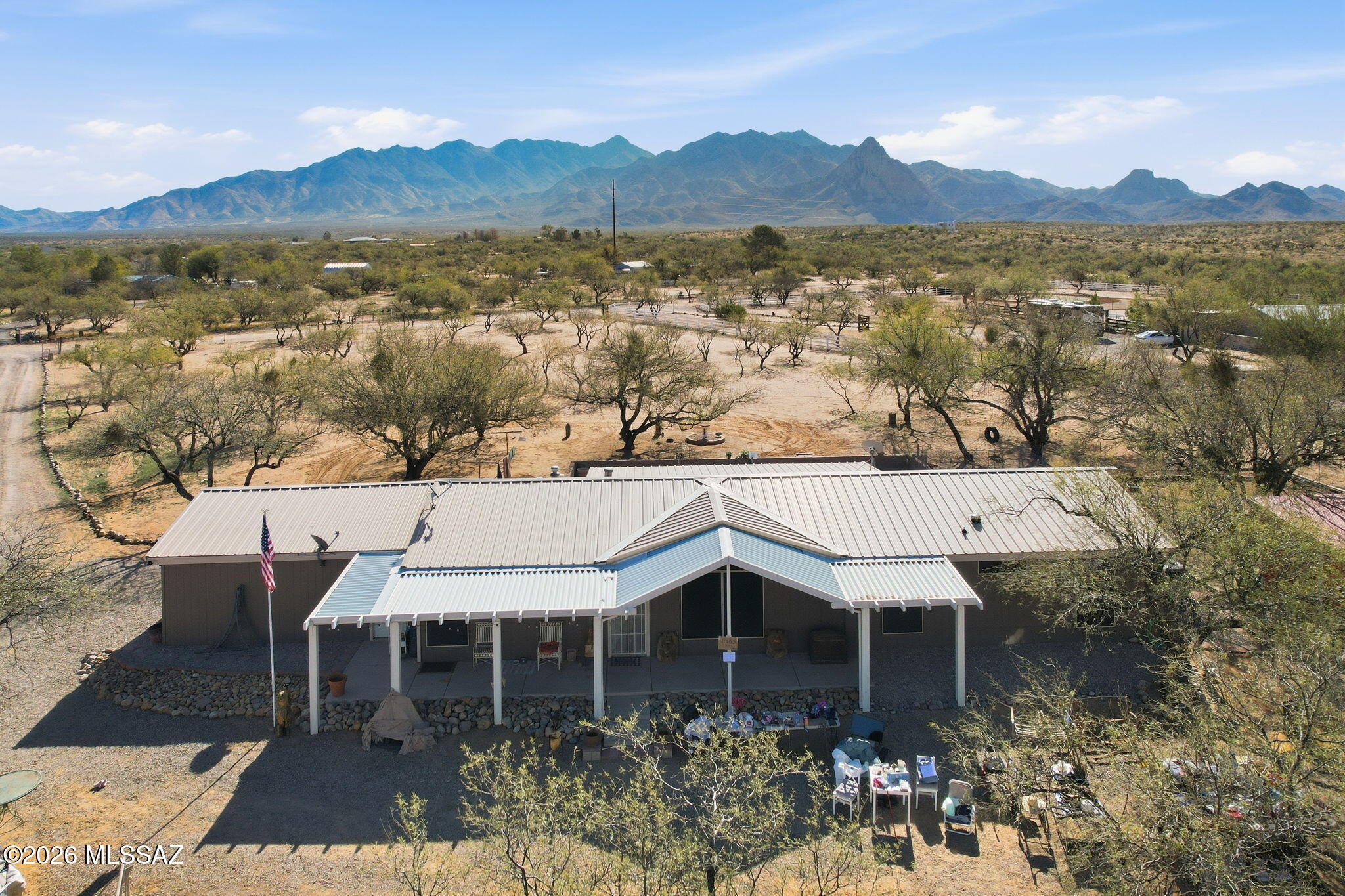 Experience the full potential of this incredible 4.14-acre property, thoughtfully designed for country living at its best. The entire acreage is fully fenced and beautifully maintained, dotted with mature mesquite trees and offering breathtaking views of Elephant Head.

Equestrian and outdoor enthusiasts will love the well-appointed horse corral and ramada, spacious 25' x 25' shop (shell), three storage sheds, cozy firepit area, and a charming garden. There's also a fully equipped chicken coop currently home to 50 chickens and 11 turkeys -- perfect for sustainable living.

The spacious home has been tastefully upgraded with modern flooring, renovated bathrooms, and thoughtful improvements throughout, blending comfort with rustic charm.

Whether you're looking for room to roam, space to grow, or simply peaceful desert views, this property delivers it all.