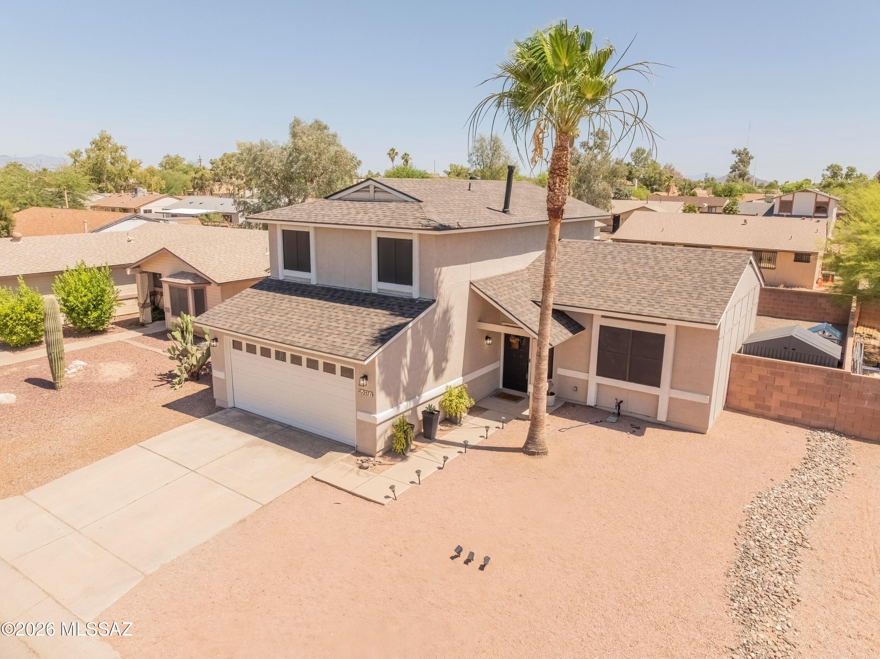 Beautifully remodeled home just a short walk to the neighborhood park! This move in ready property features stylish wood look flooring thru out the main living areas, stunning kitchen with quartz countertops, tile backsplash, stainless steel appliances, gas range, and a farmhouse sink. Newer PEX plumbing, no poly here! Convenient powder room downstairs is ideal for guests, while both the primary and guest bathrooms offer double vanities for added comfort and functionality.  Low maintenance backyard to enjoy Arizona living complete with turf and a raised garden bed. Bring those sunflowers to life! Perfect yard for relaxing, entertaining, or gardening. Thoughtfully updated and move in ready, this home offers the perfect blend of style, function and location.