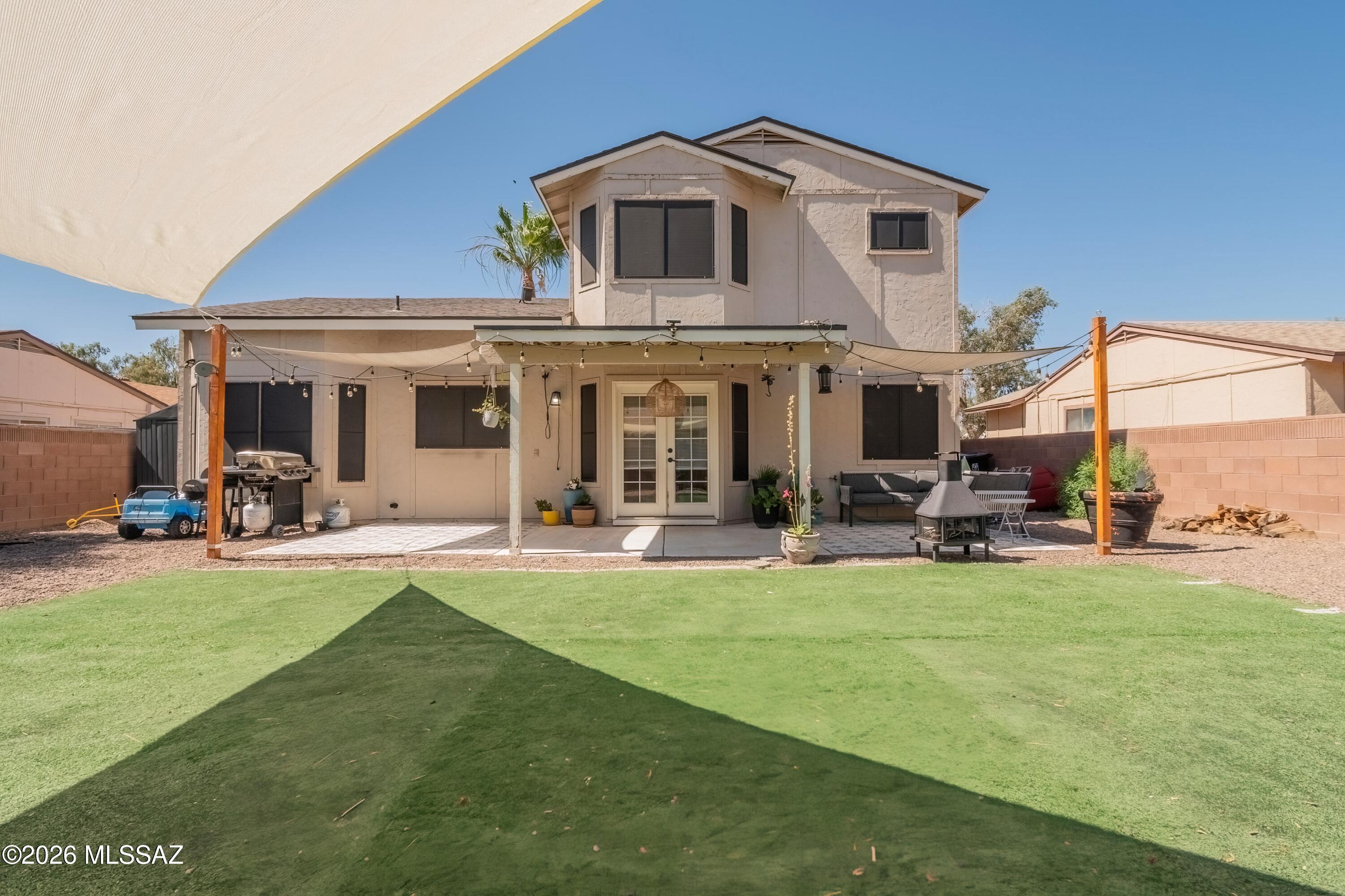 Beautifully remodeled home just a short walk to the neighborhood park! This move in ready property features stylish wood look flooring thru out the main living areas, stunning kitchen with quartz countertops, tile backsplash, stainless steel appliances, gas range, and a farmhouse sink. Newer PEX plumbing, no poly here! Convenient powder room downstairs is ideal for guests, while both the primary and guest bathrooms offer double vanities for added comfort and functionality.  Low maintenance backyard to enjoy Arizona living complete with turf and a raised garden bed. Bring those sunflowers to life! Perfect yard for relaxing, entertaining, or gardening. Thoughtfully updated and move in ready, this home offers the perfect blend of style, function and location.
