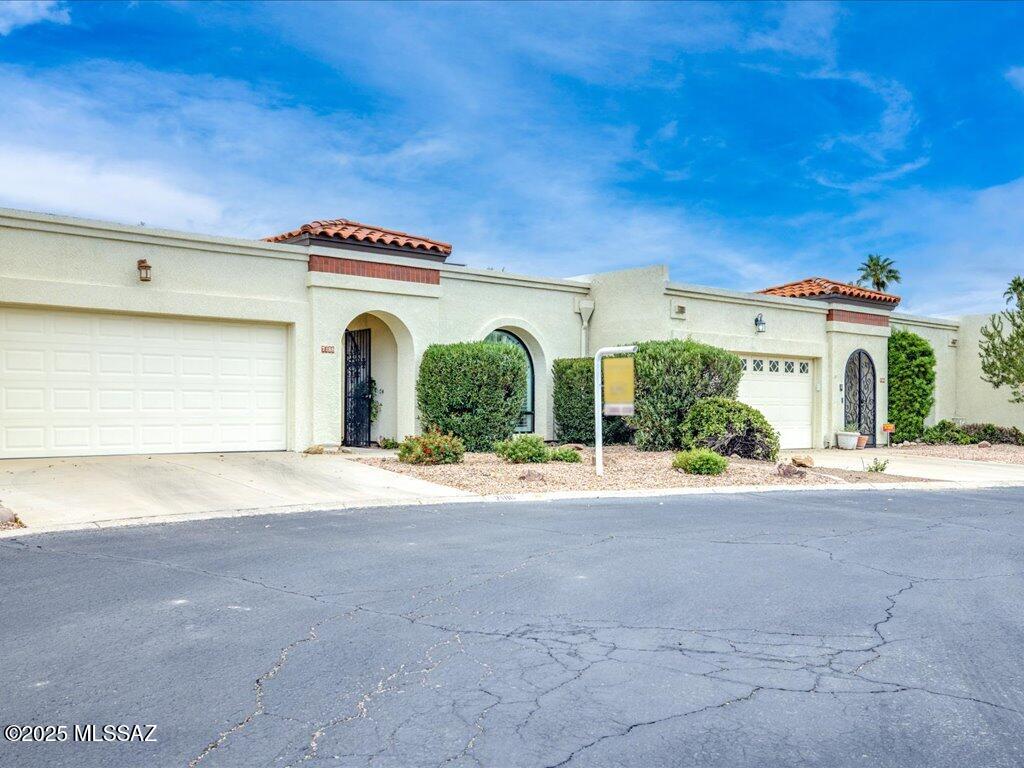 This cheerful, bright TOWNHOME & CASITA is impeccably maintained and perfectly appointed. Located in the River Ranch enclave of Rancho Del Rio Village, it's close to Udall Park, Sabino Canyon, Restaurants, and Shopping. This must-see home offers a 2-bdrm/2-bath main house and a charming 1-bdrm/1-bath Casita. Both living areas enter through a private front courtyard, enclosed by the buildings and a locked wrought-iron gate. The main house offers an expansive great room with cathedral ceilings, a fireplace, and tall radius windows. There are easy-to-maintain stained concrete floors in every room. The bright eat-in kitchen has granite countertops and newer appliances, and access to a lovely back patio. Updated Milgard windows &  sliding doors throughout. See more tab  4 additional features.. The master suite includes a walk-in remodeled shower. The Casita is a guest's delight with a spacious floor plan including a private bath. The home has a detached 2-car garage. The heated community pool and spa are a short walk away. The HOA includes private access to the nearby paved wash trail.

    *Seller-owned, separate drip system for the courtyard.
    *New induction cooktop/convection range, Bespoke refrigerator, and microwave.
    *New walk-in oversized shower in the primary bedroom.
    *The courtyard gate features a magnetic lock. A button in the courtyard can release the lock without a key. The gate release system has a battery backup to allow a keyless exit during a power outage.
    *Auto on lights added to the storage closet and laundry closet.  
   *Smarthome tech features are available for the great room, kitchen, and master suite. (Ask for details)
    *Recently updated second bathroom.
    *Under kitchen counter lighting.
    *Washer & dryer included and inside the home.
    *Undersink Reverse Osmosis for drinking water.