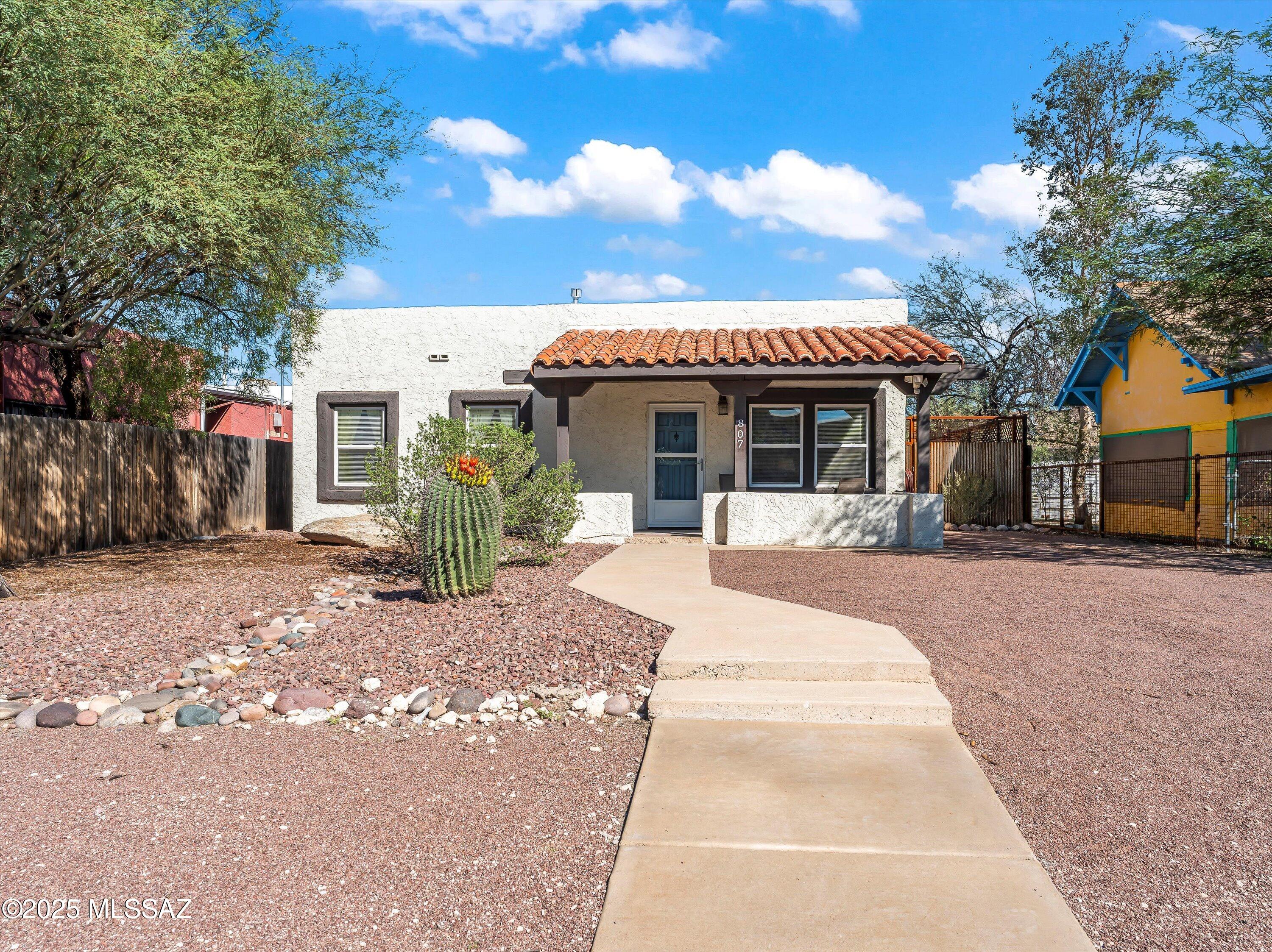 WOW! 2.25 assumable loan! Updated and move-in ready home just blocks from the University of Arizona! This charming property is located in the desirable Jefferson Park neighborhood and sits on an R-2 lot, perfect for adding an ADU or guest house. The home features 2 bedrooms, 1 full bathroom, a light-filled living space, updated kitchen and bath, dual-pane windows, and thoughtful modern touches throughout. Beautiful wood floors in the living room, ceiling fans, and efficient HVAC systems (2023) make this home comfortable year-round. Off-street parking via a private driveway and alley access in back add convenience. The deep lot offers room for expansion or outdoor living. Ideal for anyone seeking a centrally located home with long-term flexibility.