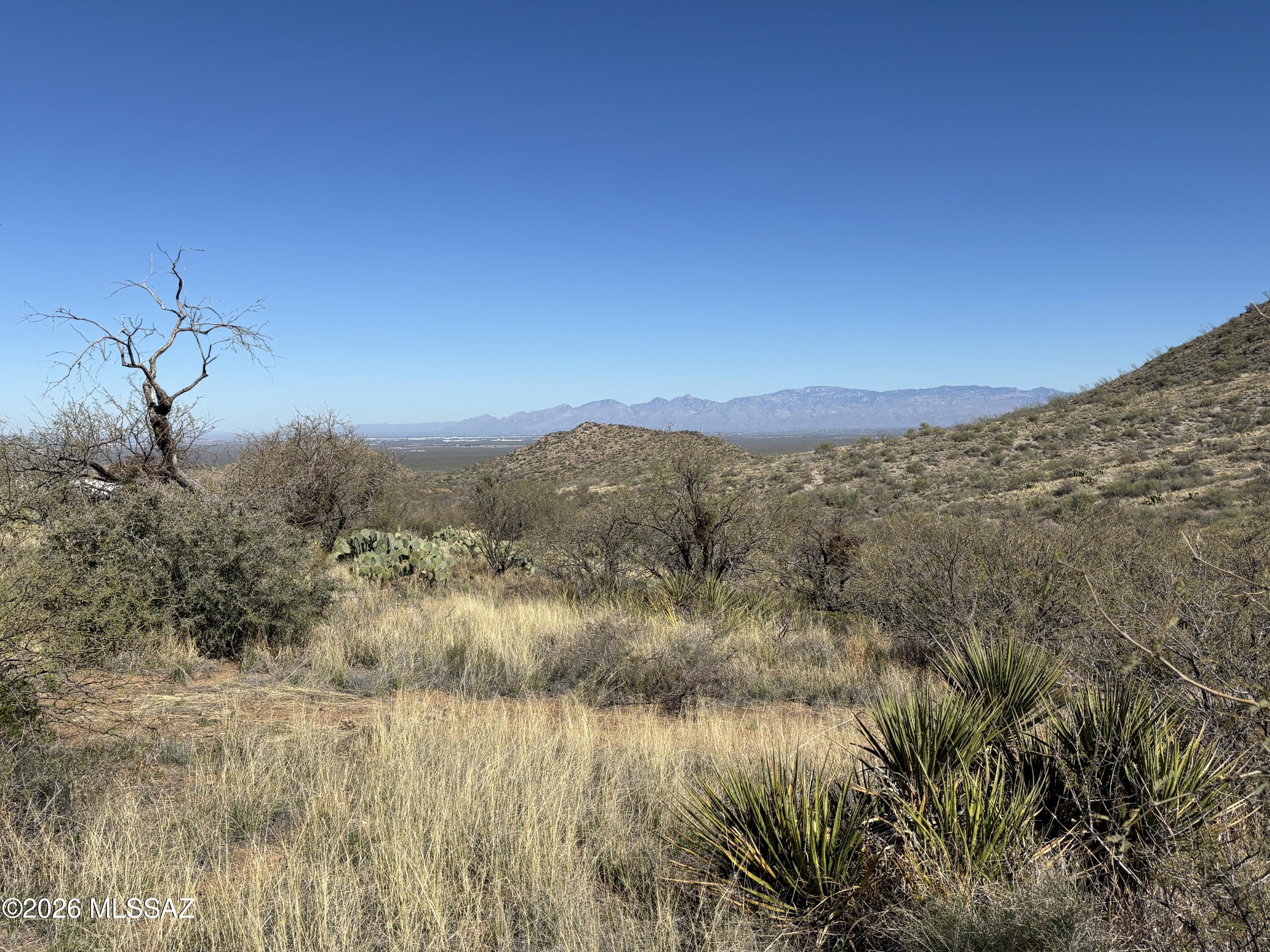 10 acres (includes parcel 305-39-292G) in the Santa Rita foothills over 4,000' ft elevation - within the highly coveted Vail school district. Very secluded homesite with panoramic views of the entire Tucson valley to the north and breath-taking mountain views to the south and east. Private well on property has never been used, but was recently inspected by B-J Drilling Co. They determined the well is 677' deep with static water level at 340'. Cost to install pump and have well operational is $13,722. Ideal spot to build your dream home. Paved road access except last 1/4 mile. Owner/agent