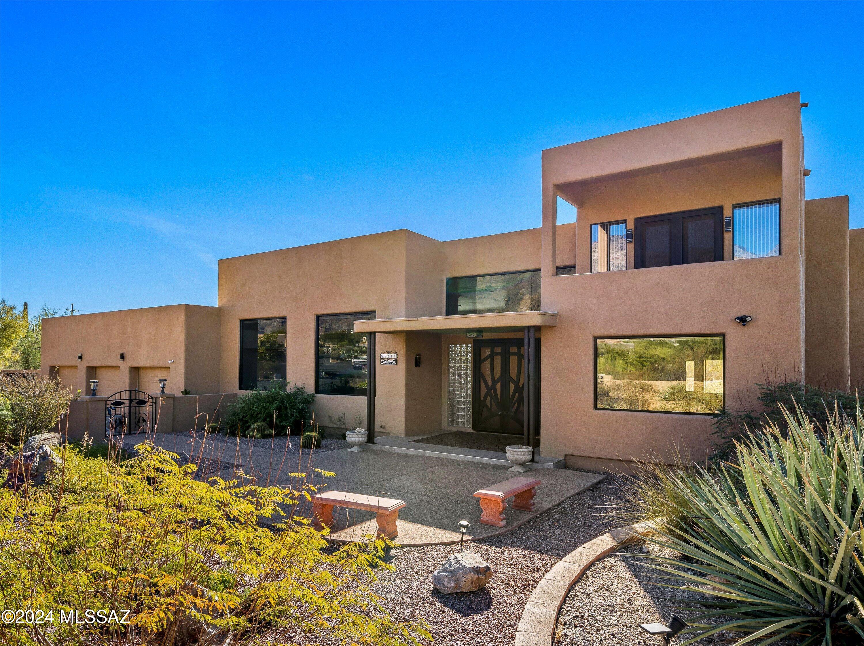 Welcome to a sanctuary where elegance meets comfort! 

Arriving at this stunning property, you are greeted by a spacious grand front courtyard on a premium lot. Step inside, and you'll be mesmerized by captivating views that stretch across the horizon. The majestic Catalina Mountains rise in the background, while the sparkling cityscape dazzles below just beyond the gorgeous pool and basketball court. This home is a treasure for those who cherish natural beauty in a gated community. 

Vast, light-filled spaces surround you, with enormous windows framing breathtaking mountain vistas. It's like living in a perpetual painting! The main level boasts three cozy bedrooms, and an additional split bonus room that can be a bedroom or office as it has a closet. LUXURIOUS SECOND LEVEL RETREAT 

Ascend to the second level, and discover your private loft space. A sumptuous bedroom awaits, along with an additional space that can be utilized as a fitness or work space. Here, you can soak in panoramic mountain views as you work or unwind in tranquility. Your private retreat awaits! The primary bedroom features a safe for your valuables and French doors leading to the back patio. The remodeled primary bathroom radiates modern luxury, with a spacious closet to accommodate your wardrobe.

CAR ENTHUSIASTS REJOICE! 

Attention car aficionados and outdoor lovers- this property has everything you need! A spacious three-car garage, plus additional large storage room, is perfect for your recreational toys. Whether it's a boat or other fun vehicles, they'll have space for all. Don't forget the backyard workshopideal for all your hobbies!

CULINARY DELIGHTS AWAIT 

Indulge your culinary talents in a splendid kitchen, adorned with Italian porcelain tile and elegant quartz countertops. The adjacent, light-filled dining area exudes charm, creating a cozy atmosphere for delightful meals with loved ones.

FAMILY ROOM WITH A VIEW 

The heart of the homethe family roommaximizes those stunning mountain views. Natural light floods the space, making it perfect for relaxation and gatherings paired with a fireplace. Ease and convenience are at your fingertips! The central vacuum system makes maintaining this beautiful abode a breeze. 


OUTDOOR ENTERTAINMENT DREAM 

The outdoor space is an entertainer's dream! A rooftop deck offers sweeping viewsperfect for gatherings. The double gate to the backyard ensures easy access for your recreational toys, keeping you ready for adventure. Picture yourself on the loft balcony, gazing at the twinkling city lights. This is your haven! The location is ideal, just a short drive from all amenities, ensuring you remain connected while enjoying your private oasis. Envision cozy nights by the wood-burning fireplace in the covered barbecue area, creating cherished memories with family and friends. The extended covered patio invites relaxation amidst nature's tranquility. 

Seize the opportunity to make this dream home yours. It's the perfect place to create lasting memories with loved ones, surrounded by the beauty of nature and the excitement of city life. Welcome home!