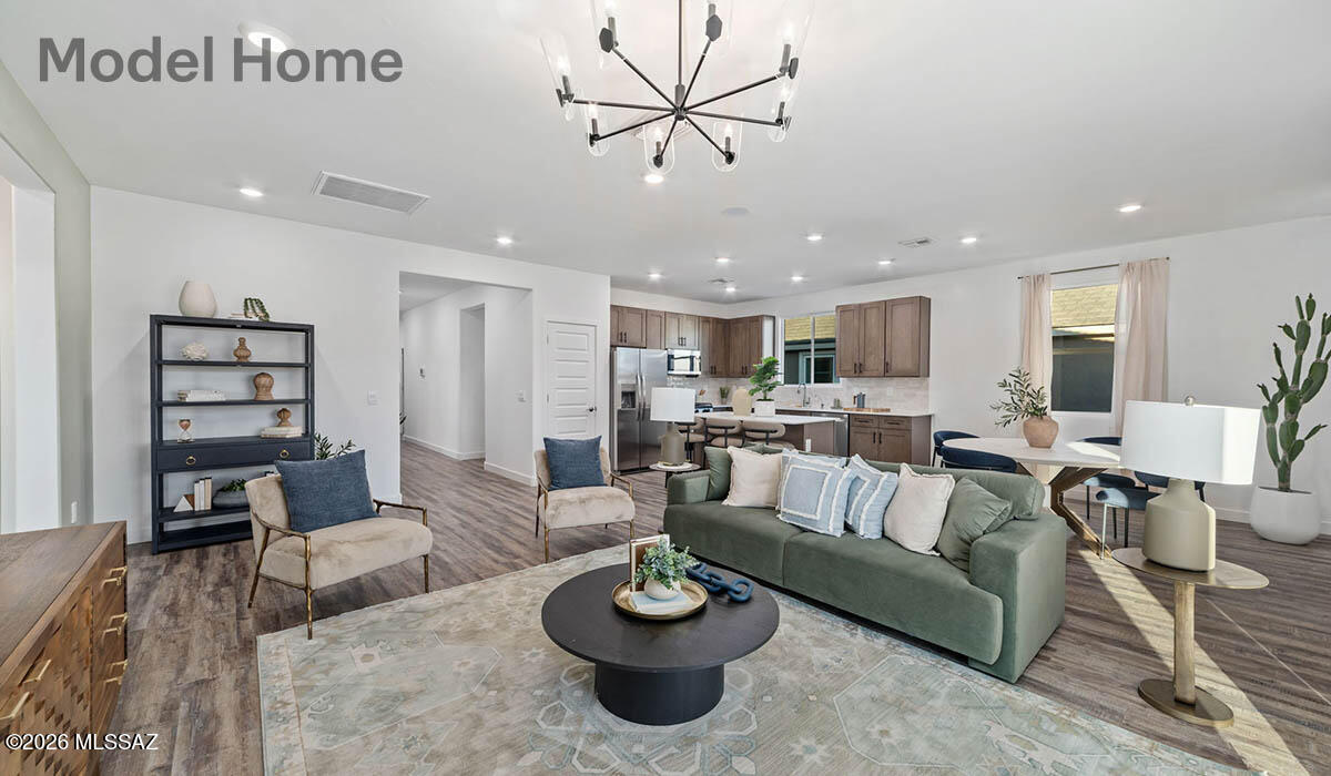 Welcome to the popular Mariposa floor plan, offering 1,897 sq.ft. of thoughtfully designed living space. This single-story home features 4 bedrooms, 3 bathrooms, including a private primary suite and a secondary bedroom- both with their own full baths, perfect for guests or multigenerational living. The open concept layout flows seamlessly from the kitchen to the dining and living areas, ideal for everyday living and entertaining. Located in the highly desirable Rancho Sahuarita community, residents enjoy resort-like amenities, including multiple pools and splash pads, 10-acre lake, recreation centers, fitness facility, pickeball and basketball courts, walking trails, and the popular Safari Park!