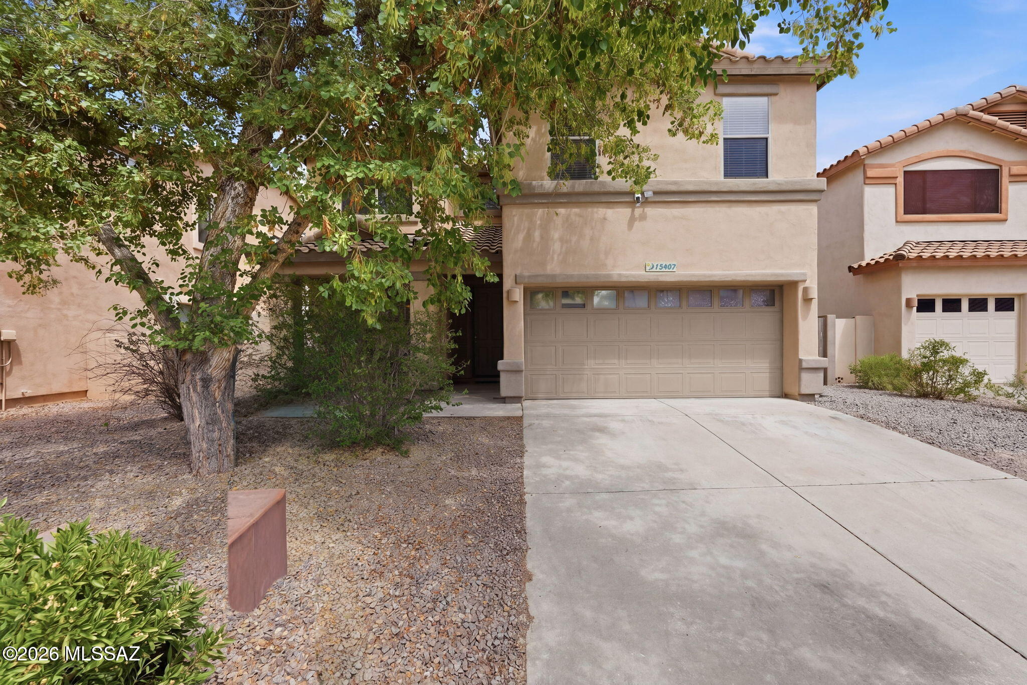 Located in a desirable gated community in Rancho Sahuarita and across the street from the neighborhood lake, this move-in ready 4-bedroom, 2.5-bath home offers space, functionality, and scenic surroundings. Fresh interior paint and recent cosmetic updates enhance the home's appeal, and all appliances ----------------------------and roof are less than six months old.

The main level features a covered front porch, formal living and dining rooms, an updated kitchen with custom granite countertops and stainless steel appliances, a breakfast nook, and a spacious family room with a gas fireplace. A convenient half-bath, along with a laundry room, completes the first floor. Upstairs, the oversized owner's suite includes a deluxe en-suite bath and a large walk-in closet. Three additional bedrooms, a full guest bath, and a versatile loft provide ample living space. The backyard is generously sized with mature landscaping, offering a private outdoor retreat. Conveniently located near the community center and amenities.