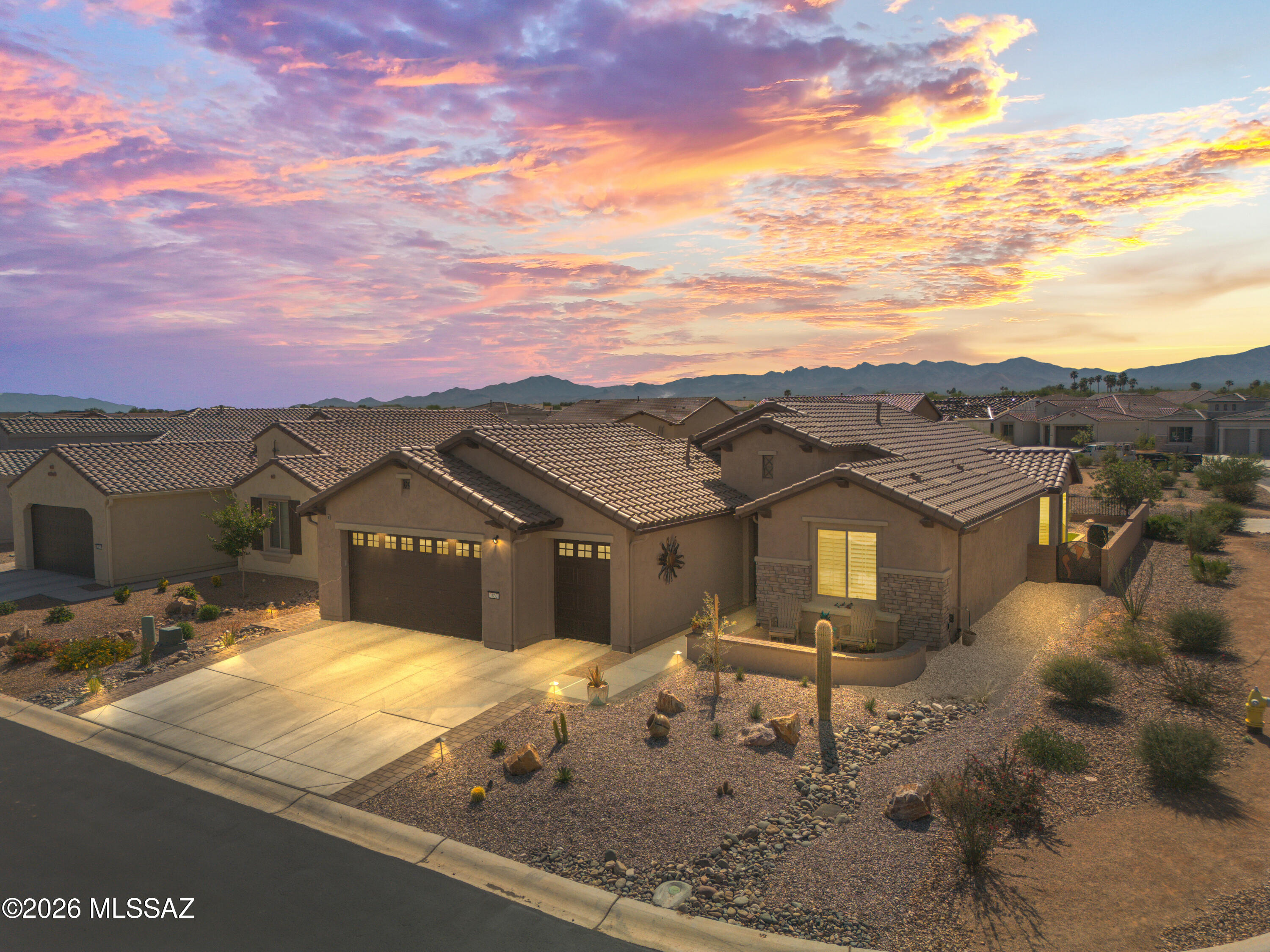 Welcome to luxury living in the heart of Quail Creek! This newly built expanded Montecito floor plan sits on a corner lot with peek-a-boo mountain views, offering both privacy and curb appeal. From the moment you arrive, you're greeted by a beautifully landscaped, fully fenced yard and an inviting courtyard, perfect for morning coffee or evening relaxation. 

Inside, no detail has been overlooked. This home is truly turn-key with every upgrade already in place. The thoughtfully designed floor plan features an expanded den and laundry room, an angled dining bay window, and an extended outdoor living space ideal for entertaining. The sparkling kitchen shines with quartz countertops, full-height backsplash, upgraded cabinetry with crown molding, all soft-close features, and premium fixtures The upgrades continue throughout with tile flooring in main living areas, upgraded carpet in bedrooms, 5¼" baseboards, and whole-home sound insulation. Bathrooms boast quartz counters, upgraded tile surrounds, and sleek glass enclosures. 

Enjoy modern convenience with a whole-home water filtration system, upgraded electrical and lighting package, and Pella windows with luxurious plantation shutters throughout. 

Step outside to your private backyard retreat featuring power shade screens and a therapeutic hot tub, complete desert landscaping, artificial turf, the list goes on creating your own personal oasis. 

Car enthusiasts and golfers alike will love the 4ft extended garage with easy to maintain epoxy floors, utility sink, and dedicated golf cart garage. 

This is the one that truly has it all--location, upgrades, and lifestyle.