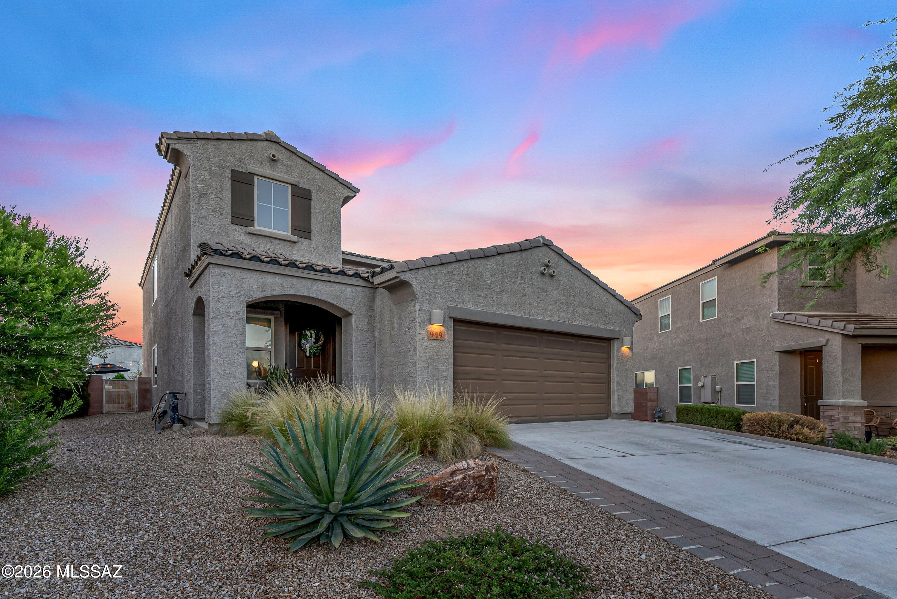 Welcome to this beautifully maintained four bedroom, two and a half bath home with a loft in the desirable Madera Highlands community. A covered front entry opens to a welcoming foyer with a modern stair railing and an open-concept floor plan. The kitchen features rich espresso cabinetry, granite countertops, subway tile backsplash, and overlooks the main living area, making it perfect for everyday living and entertaining.

The downstairs primary suite offers a custom wood accent wall, oversized barn door leading to the ensuite, dual vanities, walk-in shower, and a walk-in closet with custom built-ins. Plantation shutters throughout, a downstairs laundry room with storage cabinets, and three additional bedrooms with a spacious loft upstairs provide both comfort and functionality. The true showstopper is the backyard, one of the largest lots in the neighborhood! Designed for entertaining and enjoying Arizona living, it features an extended paver patio that wraps around both sides of the home, a large turf area, built-in outdoor kitchen with barbecue, café lighting, mature privacy hedges, and stunning mountain views. Whether you're hosting friends or relaxing under the open sky, this outdoor space is truly a dream.

Additional highlights include a 2-car garage with epoxy flooring and built-in storage cabinets, making this home as practical as it is beautiful.

Seller willing to contribute to Buyers closing costs!
