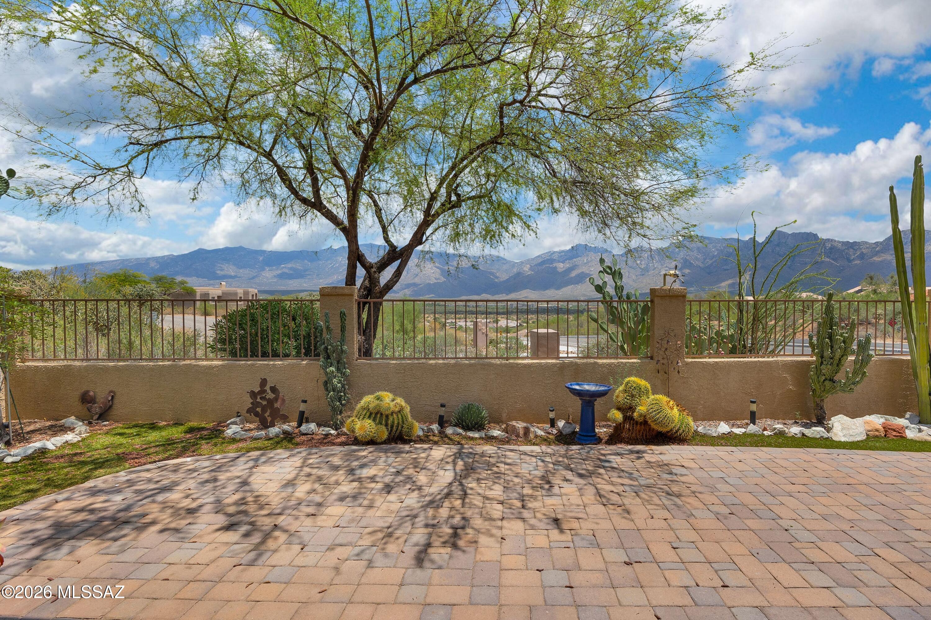 Welcome to Your Next Chapter in Oro Valley!
Nestled in the ''Valley of Gold,'' this darling 3bedroom, 2.5 bathroom patio home offers the perfect blend of luxury living, convenience, and comfort. Situated on a spacious lot that offers easy access to the area's beautiful walking paths, this property is designed for an effortless indoor-outdoor lifestyle against the captivating backdrop of the majestic Santa Catalina Mountains.Step inside to a bright, open great room featuring a cozy fireplace just off the kitchen ideal for both relaxing and entertaining.
Recent upgrades include-Fresh Interior Paint throughout Newer HVAC,Newer Anderson Windows paired with elegant plantation shutters
Newer Appliances, kitchen cabinets, granite counters,  owned soft water system. The Ultimate Lock-and-Leave Lifestyle

Located in a secure, gated community, this home is the perfect "lock-and-leave" property. 
The HOA covers:Roof maintenance and exterior paint,Front landscaping, Community gates, private roads, and the pristine community pool and spa.Beyond your front door, Oro Valley offers a rich lifestyle full of amenities. Enjoy nearby walking and hiking trails, or hop onto The Loop, the famous bike path that wraps all the way around Tucson. The neighborhood features a dedicated dog park and a playground for the little ones.Everything you need is just minutes away:Conveniences: Grocery stores, top-rated Oro Valley schools, and the Oro Valley Hospital.Entertainment & Dining: The nearby Marketplace features a movie theater, fantastic restaurants, and the highly anticipated Mountainside Fitness center (opening soon!) and much more!This little gem truly offers the luxury living and comfort that will meet all your needs. It is the perfect place to call home for your next chapter!