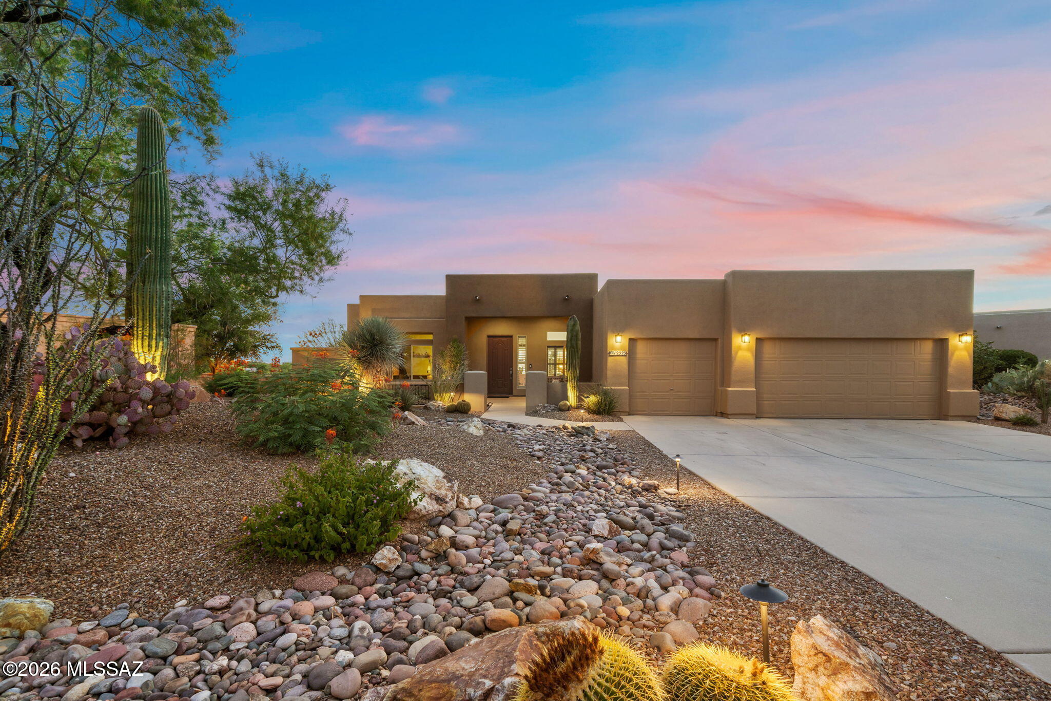 Beautifully crafted luxury retreat in Oro Valley, recognized by numerous national publications for its quality of life & community appeal. This meticulously maintained 4-bed, 3-bath split floorplan features all the bells and whistles! Solid floors (No carpet), Solid doors, Plantation shutters & Newer dual-pane windows that flood the space with natural light. A showstopping redesigned kitchen, boasts quartz counters, KitchenAid appliances, & large island. Enjoy total efficiency with a TEP net meter solar system & EV car charger. Situated on an elevated lot, this entertainers dream backyard features stunning views, extended patio with automatic shades, built-in BBQ, & a pebble-tec pool with waterfall & lagoon. Every detail invites you to say, ''this is a property I am proud to call Home!''
