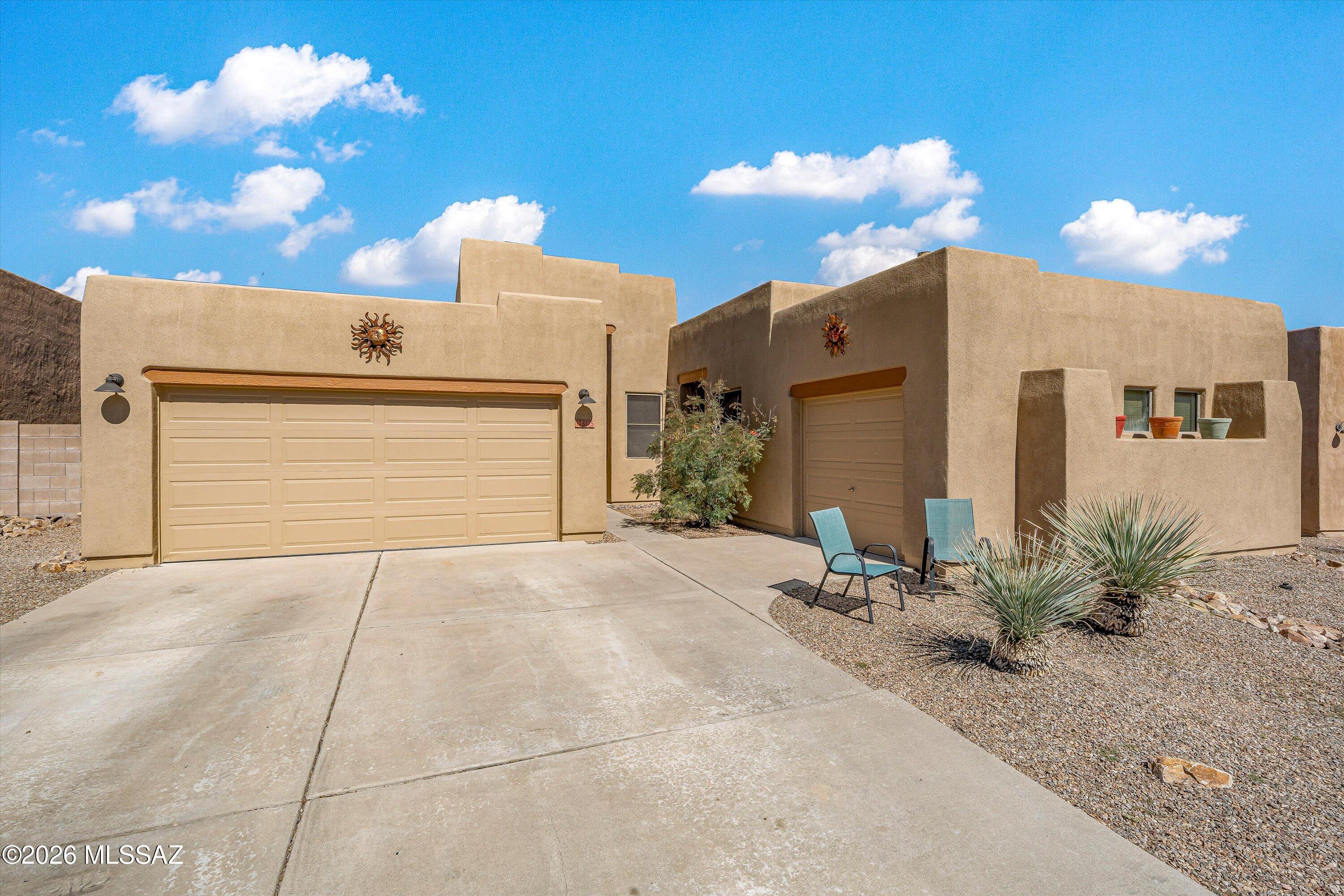 This stunning Santa Fe-style home backs directly to open space, delivering exceptional privacy and year-round serenity in a tranquil desert setting. The heart of the home is a spacious, inviting kitchen featuring a gas cooktop set into elegant Corian countertops, along with a large center island that overlooks the comfortable family room with its cozy beehive fireplace. Dining options are versatile, with a bright breakfast nook and a separate formal dining area. Beautiful custom window coverings are included throughout. The generous primary suite boasts a luxurious en suite bathroom with dual sinks, two spacious closets, and a frameless glass shower.
Outside, the private backyard is an entertainer's paradise, highlighted by a sparkling PebbleTec pool and a soothing water feature-- --ideal for relaxing or hosting unforgettable gatherings with family and friends.
This beautifully maintained, move-in-ready home is truly picture-perfect and ready for you to enjoy Arizona's stunning desert lifestyle.
