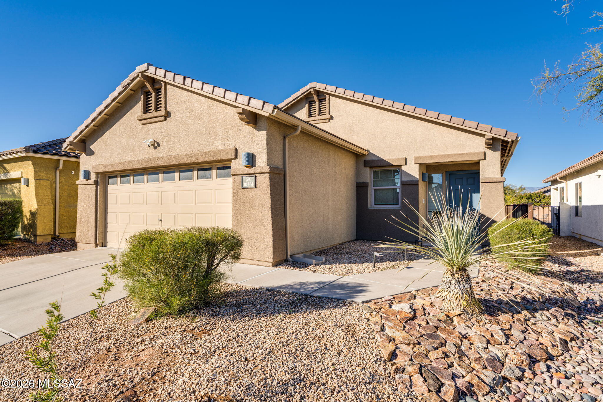 Welcome home to this well-appointed 3-bedroom, 2-bath residence with 1,456 sq ft, ideally located in Civano II on Tucson's desirable Southeast side and within the Vail School District.
The interior features an open, airy feel with high ceilings and abundant natural light, enhanced by a skylight in the hall bathroom. The kitchen is designed for both function and style, offering an island, stainless steel appliances, and a gas range. Tile and laminate flooring throughout—no carpet—adds durability and easy maintenance, while newer ceiling fans provide year-round comfort. The primary suite is a relaxing retreat with a bay window overlooking the backyard and an ensuite bath featuring a soaking tub and separate shower. Refrigerator, washer, and dryer convey, making this home truly move-in ready.
Step outside to a full-length patio with porch and a blank-slate backyard, perfect for creating your own custom desert oasis. The oversized garage with a 240 volt EV charger and workbench offers excellent storage and workspace.
Enjoy all that the Civano II community has to offer, including a community pool, basketball court, jogging/bike paths, parks, and a recreation center, an ideal blend of comfort, convenience, and lifestyle.