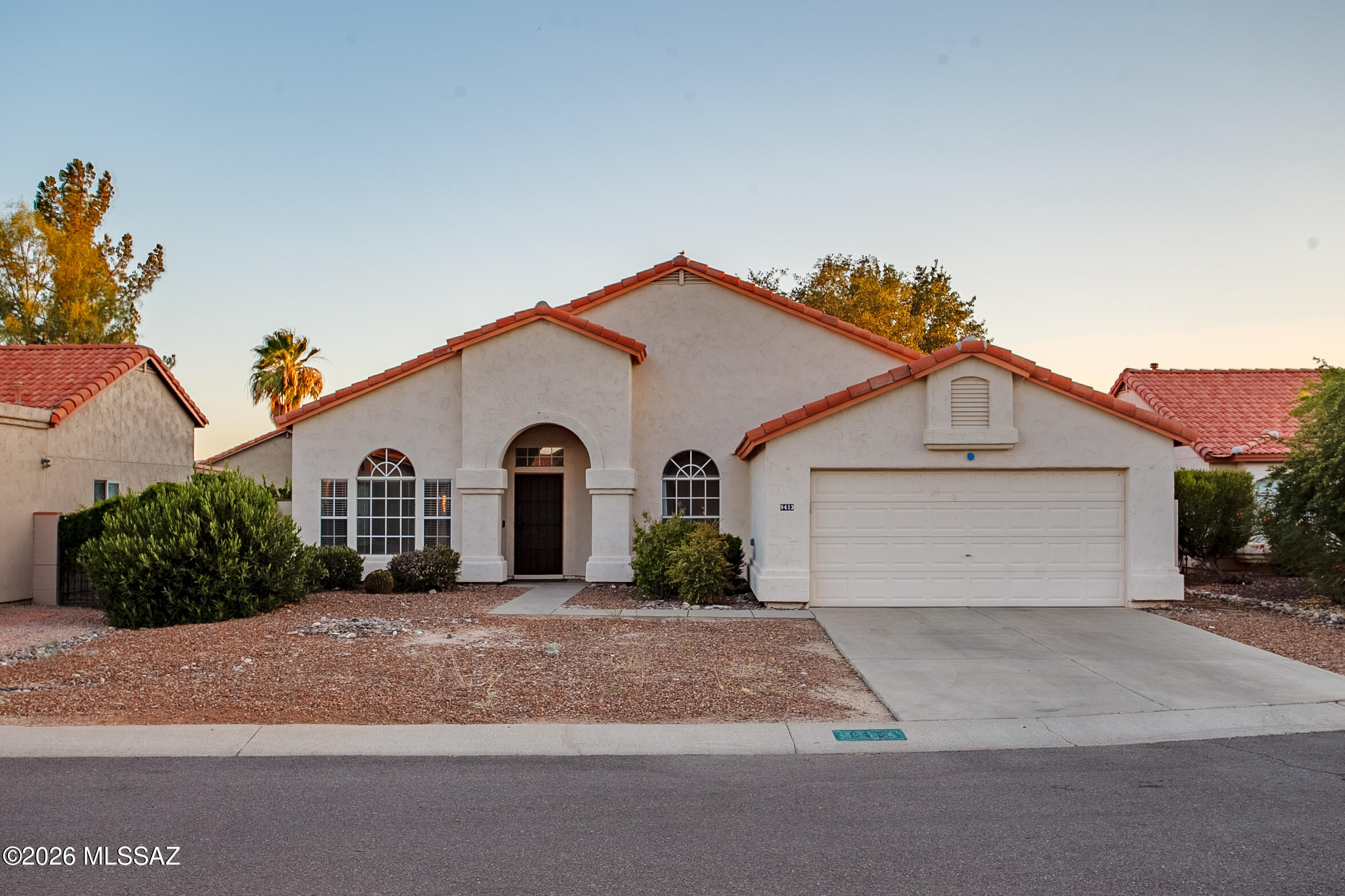 NO HOA ! Clean & Move-in ready! This lovely 3-bed 2-bath 2-car garage home in desirable NW area offers modern comfort & convenience. Enjoy a bright open floor plan with high vaulted ceiling, two separate living rooms and tons of natural light. Big kitchen with big peninsula/and great sized desk/breakfast nook. Two separate spacious living rooms offer more options for entertaining and living. The private primary suite includes a walk-in closet & dual-vanity bath. Very large backyard with a gravel, mature trees & covered patio. Premium cul-de-sac lot with sunset in backyard and attached 2 car garage. Ideally located near I-10, schools, hospitals, restaurants, grocery stores & shopping (Tucson Premium Outlet). MUST SEE TODAY!