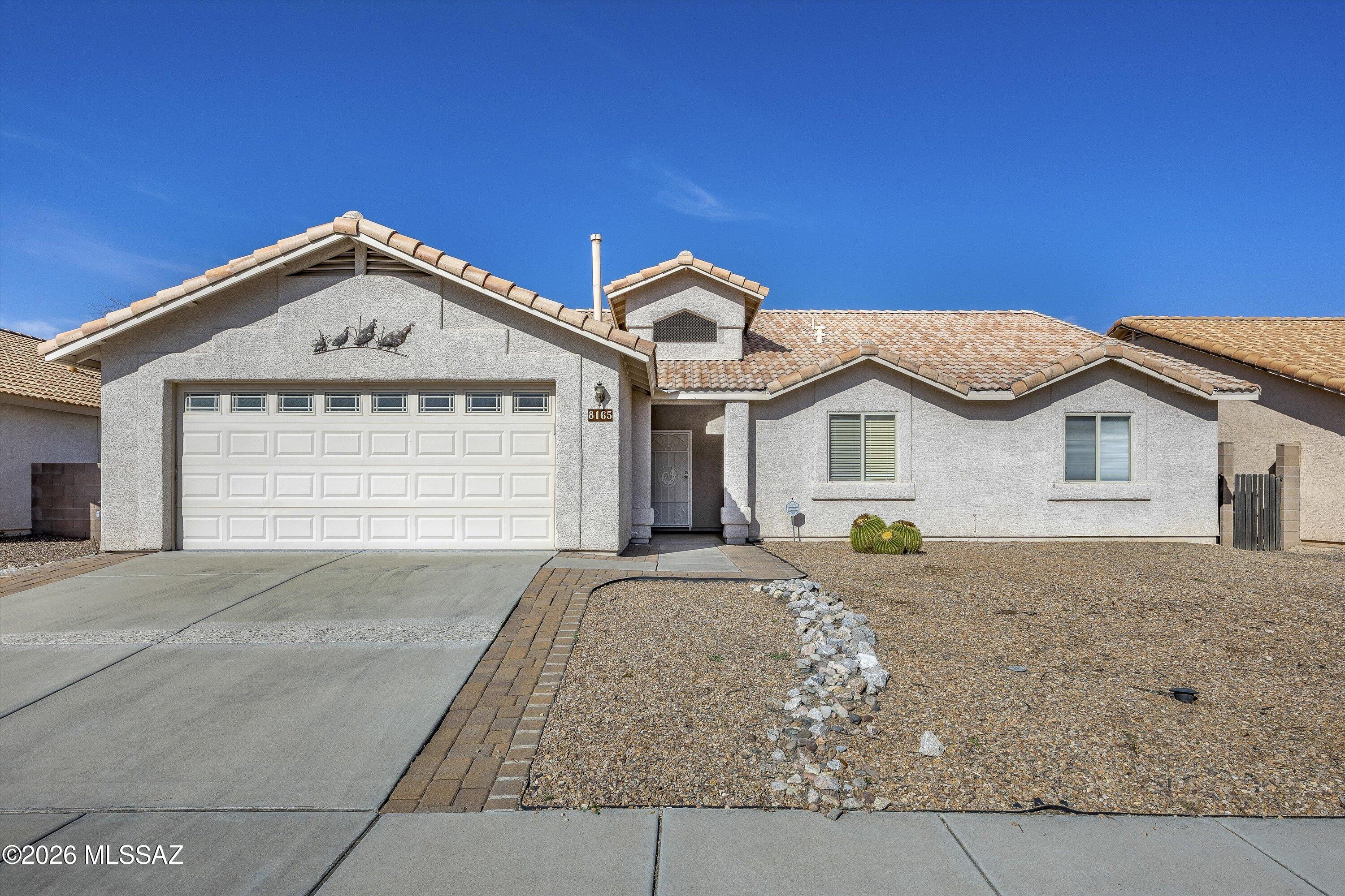 Nestled in a small, hidden, Robb Ranch subdivision with Pride of Ownership! This 4 bedroom (with a den),  2 full bath greets you with soaring ceilings and open floor plan. Wonderful updates make this home feel like new.  Tile thoughout (No Carpet). The kitchen features beautiful stainless steel appliances and upgraded quartz countertops, fabulous Island breakfast bar that flows into great room... perfect for entertaining! Spacious bedrooms and large Primary suite features a walk-in closet, 2 car garage with epoxy floor. Low car backyard with raised beds, trees, pavers and turf.