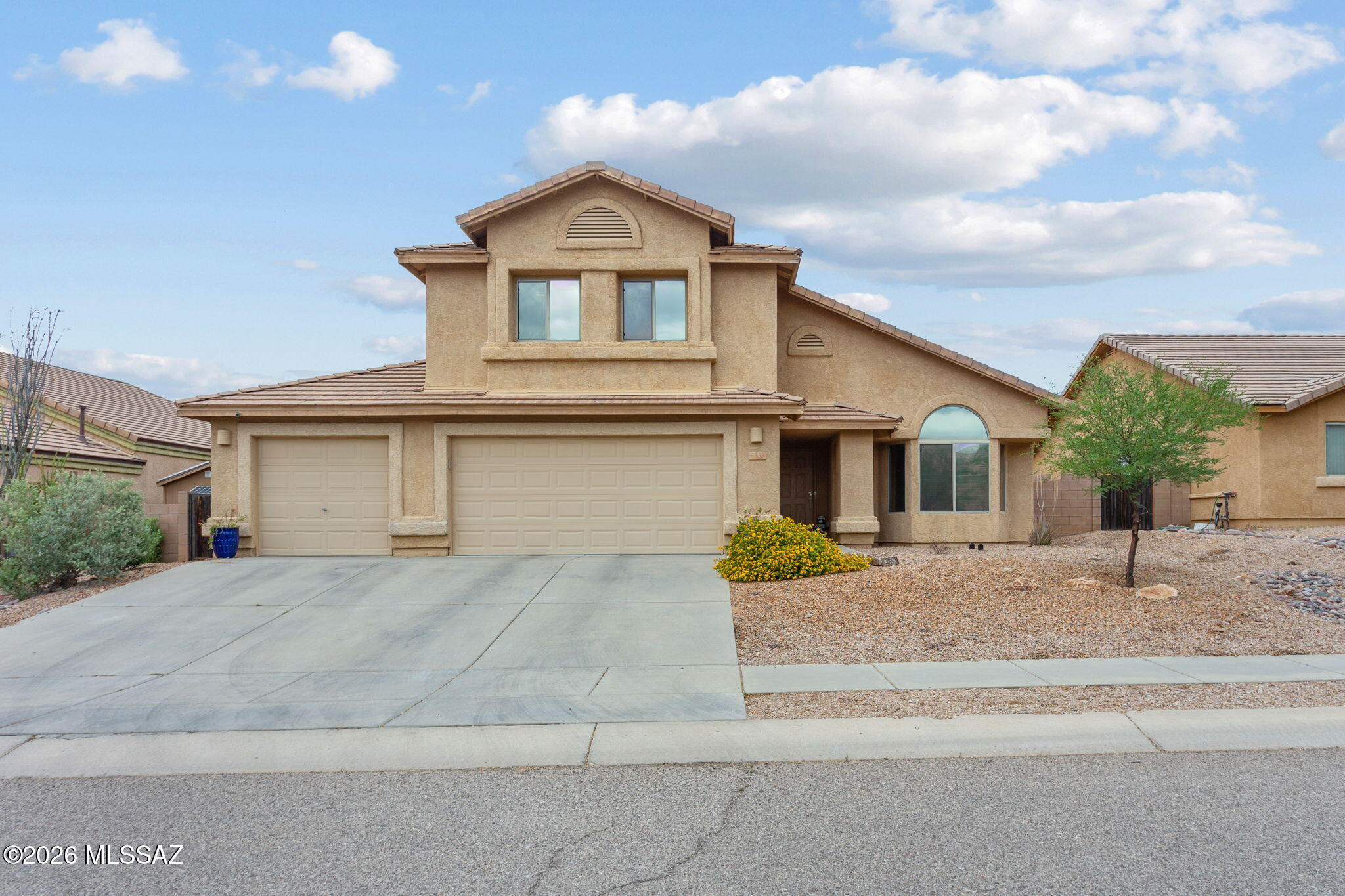 Range Priced $420,000-$460,000.  FULLY ASSUMABLE LOAN-ASK AGENT FOR DETAILS. Beautiful & spacious two-story home in Corona de Tucson, located within the highly sought-after Vail School District. This 5-bedroom, 3-bath home offers a versatile layout with one bedroom and a full bathroom downstairs--ideal for guests, multi-generational living, or an office/gym. Inside, enjoy multiple living spaces including a welcoming family room, separate living room, dining area, and a beautiful kitchen with ample cabinetry and breakfast bar. New 2023 AC units and tankless water heater give you efficiency and peace of mind! The backyard is thoughtfully finished with natural grass, a greenhouse, flower beds, a fire pit area, and a cowboy pool with custom lounge chairs, perfect for relaxing or entertaining.