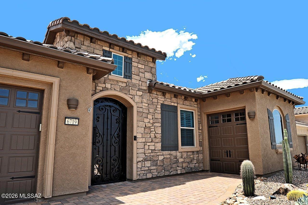 Stunningly upgraded 2BD/2.5BA+den 2,514 sq ft Journey model situated on 9th fairway of Gallery golf course offering panoramic views.  Located in the Active Adult Del Webb Community at Dove Mtn.  Loads of upgrades/updating in recent months. New interior paint & amazing 20x30 inch tile added throughout (no carpet). Kitchen & primary bath feature chiseled edge quartz.  New tile accents in kitchen,bar & powder rm, new vanity in powder rm.  Beautiful courtyard gate & fountain,new driveway pavers ,new pergola extension & extensive landscape updating in front/back. Upgraded LED & other lighting. Mini split added to primary bedroom & new epoxy garage coating. Also a 3rd car separate golf garage & owned solar.  Some furnishings for sale.  Come up and enjoy the amazing Dove Mountain lifestyle!
