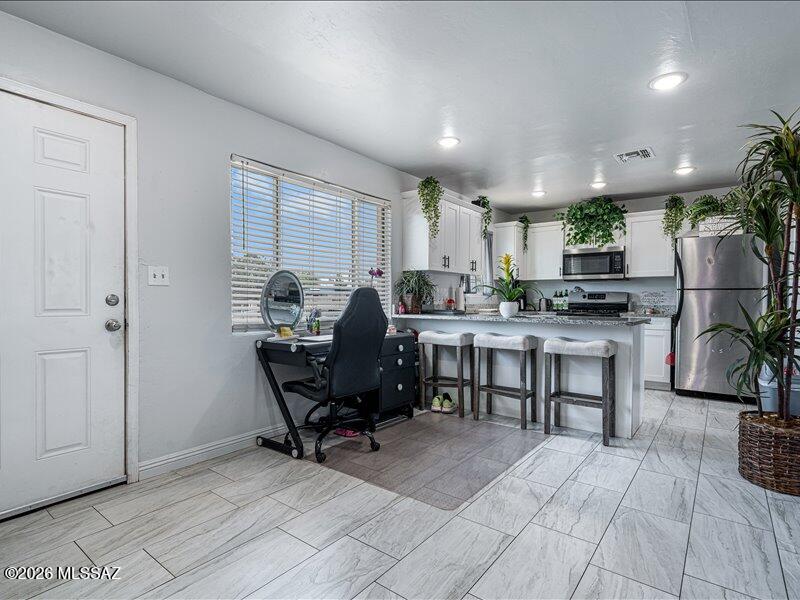 Beautifully remodeled and fully fenced, this move-in-ready home offers comfort, style, and an unbeatable location close to parks, schools, restaurants, shopping, and everyday conveniences. Inside, you'll find a bright and inviting living and dining area featuring wood-look flooring, a neutral color palette, recessed lighting, a cozy wood-burning fireplace, and French doors that open to the spacious backyard. The updated kitchen is thoughtfully designed with stainless steel appliances, white shaker cabinetry with crown molding, granite countertops, and a convenient breakfast bar. Generously sized bedrooms offer ample closet space. Expansive backyard provides endless possibilities entertaining,gardening, or creating your own outdoor retreat.