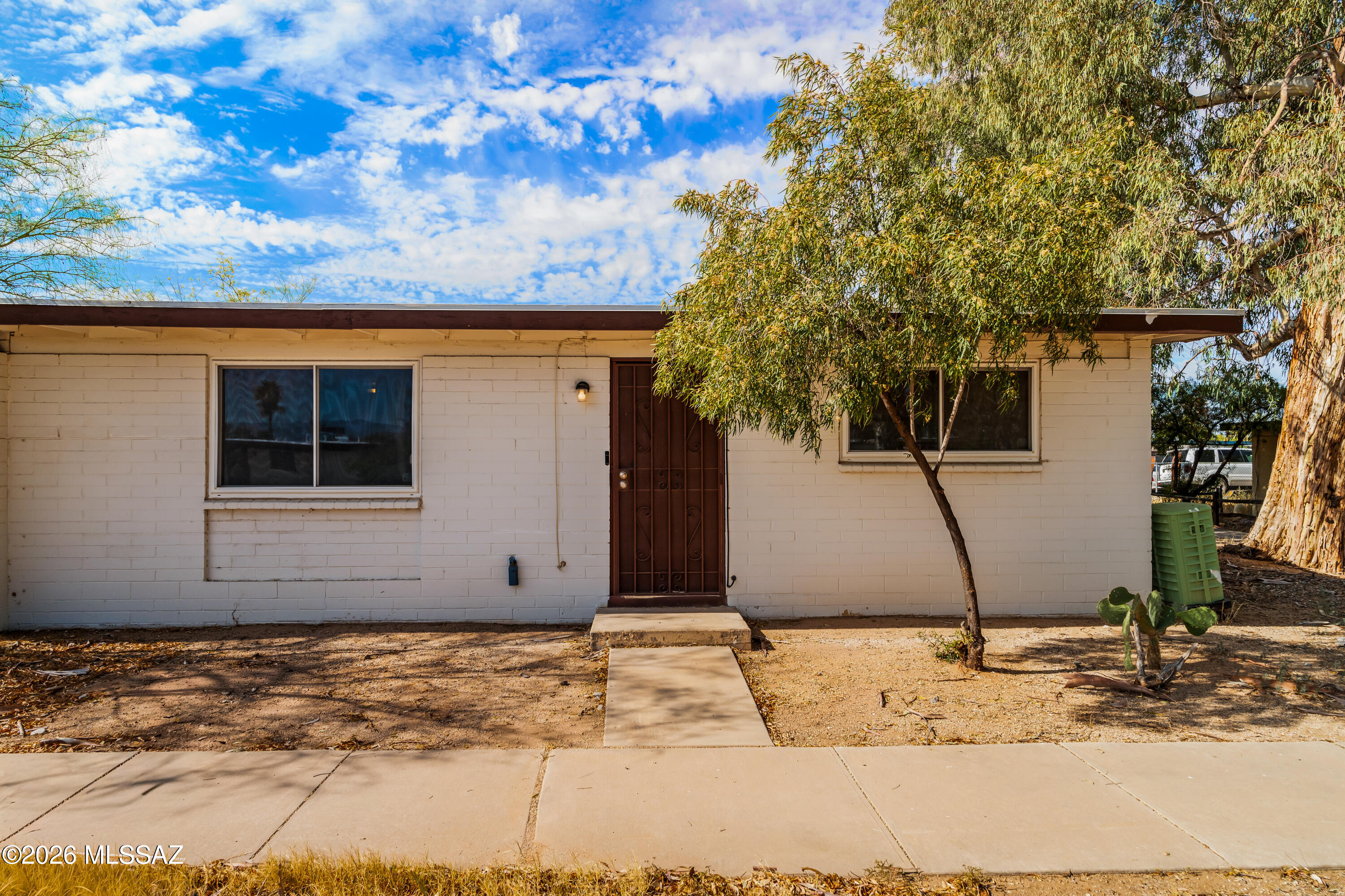 Discover this charming 2-bedroom, 1-bath townhome located in the desirable Groves Lincoln neighborhood. Enjoy beautiful surrounding mountain views and a peaceful setting with a spacious shared community lawn. The property features a private carport in the backyard for convenient parking. All appliances are included with the sale, making this home move-in ready.