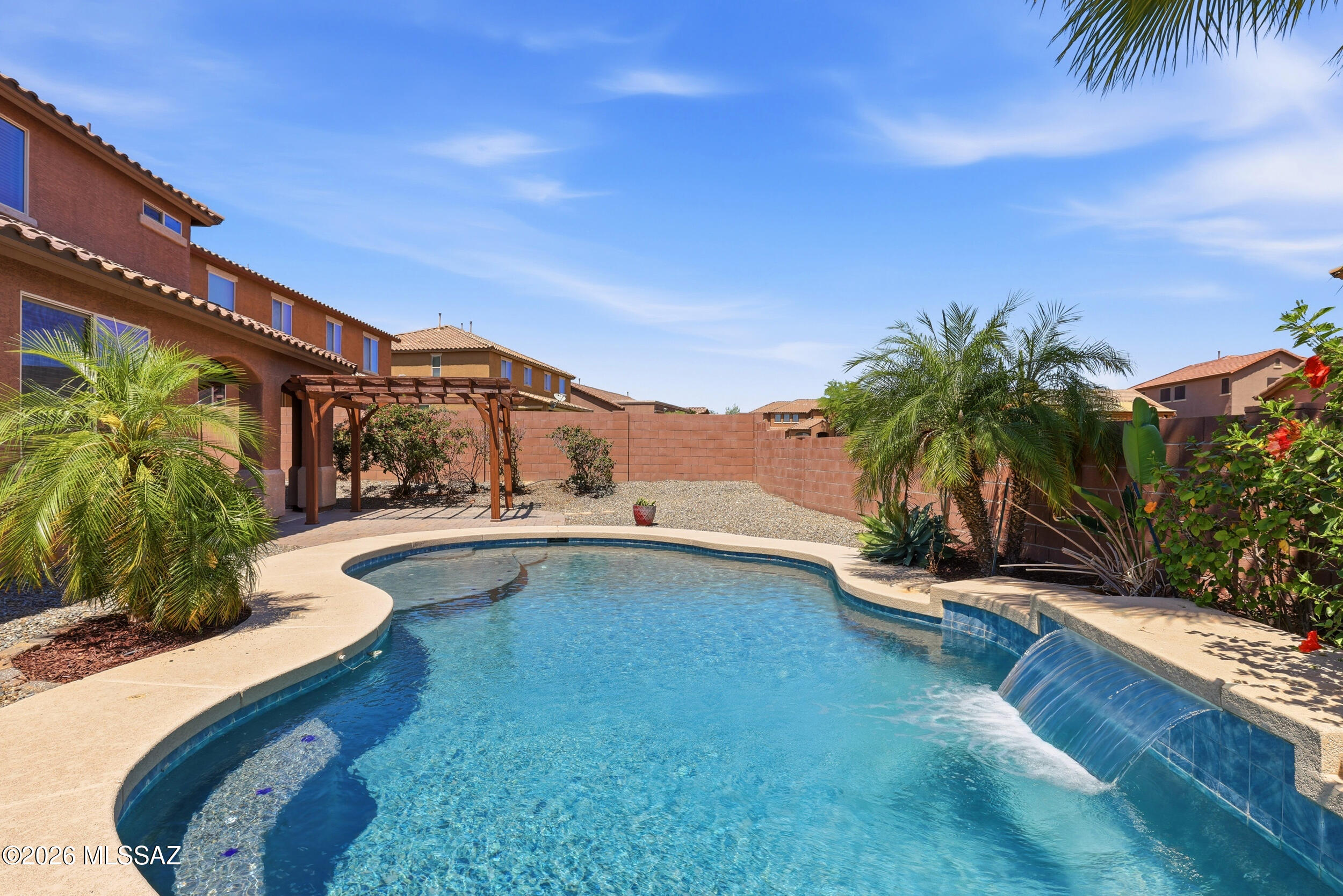 Stunning move-in ready 5BR/4BA pool home in gated Tangerine Crossing! Freshly painted interior throughout--including baseboards & doors--with brand new carpet upstairs. 3,664 sqft contemporary two-story built 2014 features open great room, formal dining, gourmet kitchen with light granite, walk-in pantry, gas cooktop & stainless appliances. Versatile upstairs loft, rec room & sitting room. Luxurious primary suite with granite double vanity. Resort-style backyard: sparkling pool, hot tub, covered patio. 3-car garage, energy-efficient lighting. Gated community with park & sidewalks, low $260/qtr HOA. Top Marana Schools--Dove Mountain CSTEM K-8 & Mountain View HS. Close to Dove Mountain, golf, hiking & dining!