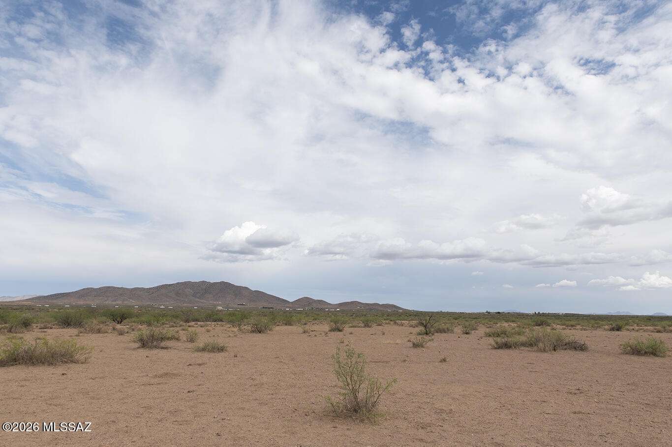 This Cochise County, Arizona property offers a beautiful opportunity to own land in a scenic desert setting. Surrounded by stunning views of the Winchester, Dos Cabezas, and Chiricahua Mountains, it provides the perfect backdrop to build your dream home or invest in land.

Enjoy peaceful rural living while still being only about 20 minutes from town, giving you quick access to shopping, dining, bars, and essential services. Outdoor enthusiasts will appreciate nearby opportunities for camping, hiking, fishing, and off-roading, while birdwatchers will love the close proximity to the Willcox Playa Wildlife Area.