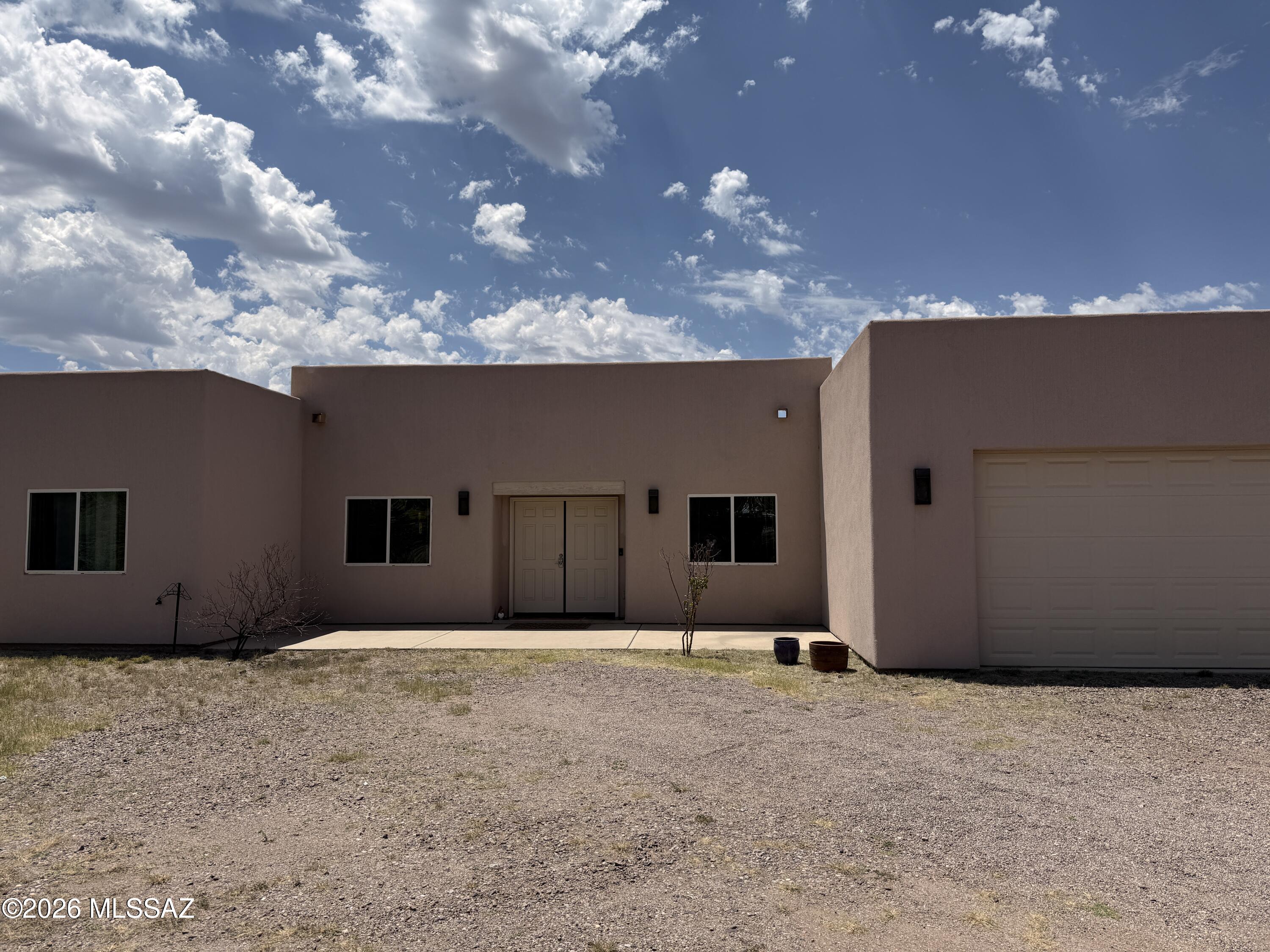 Beautiful unobstructed views of the Patagonia Mountains. This three bedroom custom home offers an open floor plan. Sitting on 2 acres of usable land, this property is a Gem and a must see in the Patagonia area. Lots of privacy yet easy access to Hwy 82. It has a fully screened Patio were you can relax and enjoy the unbelievable  views and serenity. It has a private shared well.