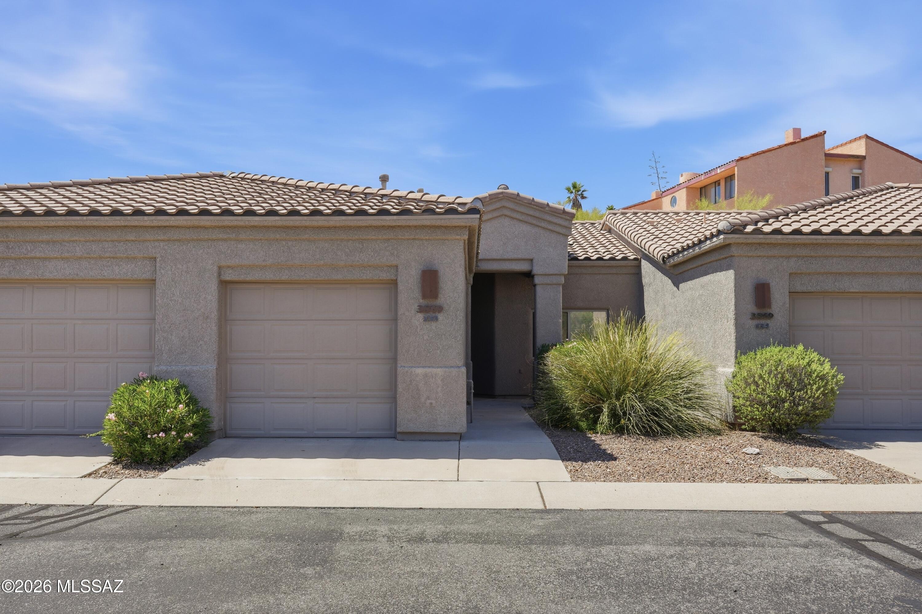 Enjoy mountain views from this convenient, affordable opportunity for Foothills full-time or ''Snowbird'' living, or an excellent investment/rental property, in a dynamic, well-located gated area. this well-maintained townhome is located near Whole Foods, excellent restaurants, BASIS and Gregory schools, with easy access to downtown, the U of A & River Walk. Just minutes to Tucson Medical Center, Sabino Canyon and golf. Tile floors in all areas-no carpet! An updated kitchen provides Quartz counters, handsome custom wood cabinets, stainless steel appliances, pantry, breakfast bar seating and a nearby dining area. The Primary bedroom has a walk-in closet, dual sink vanity and a door to the covered patio. The ample second bedroom also provides a walk-in closet and has a hallway full bath.