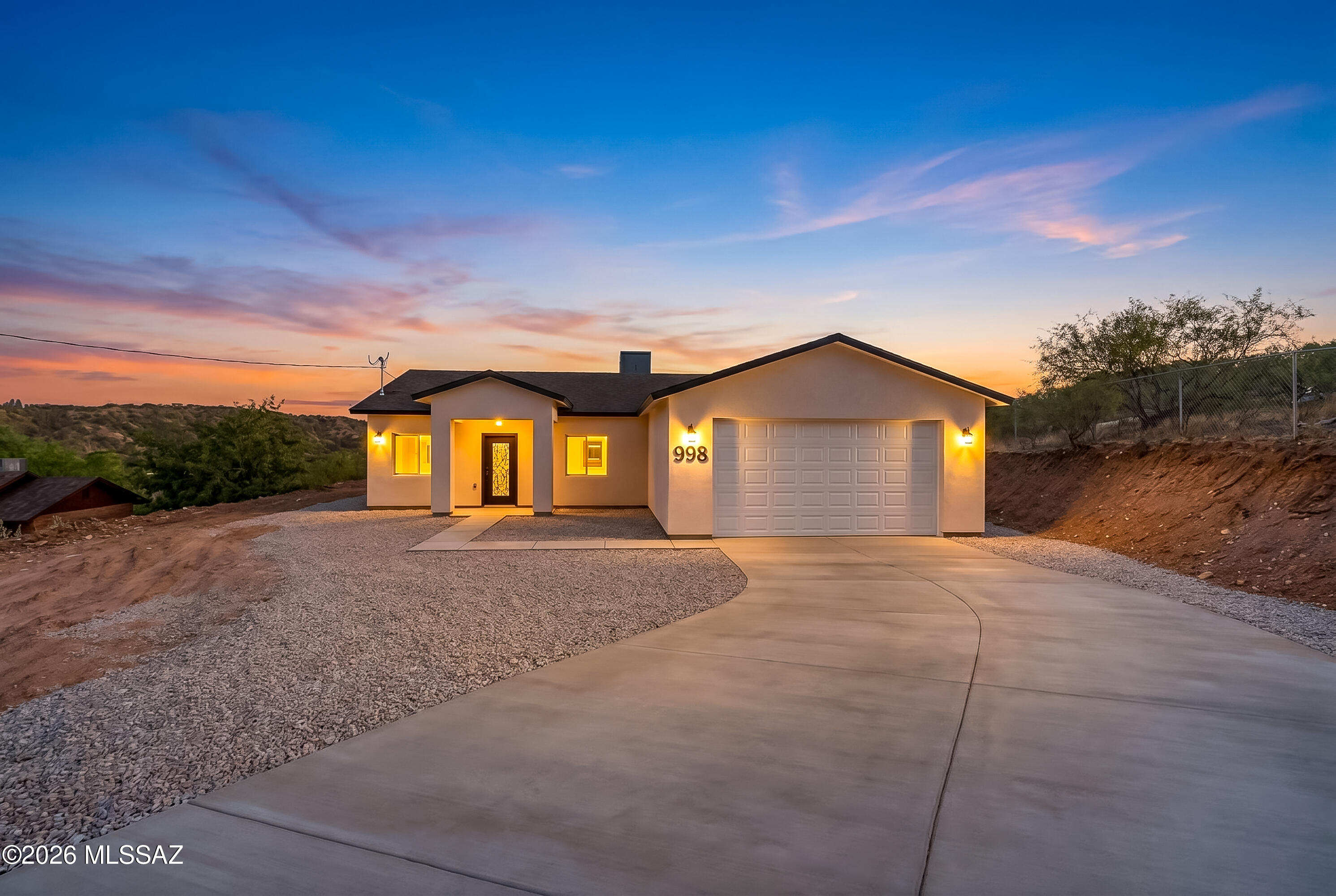 Nestled in one of the area's most desirable neighborhoods, this exceptional home offers the perfect blend of comfort, style, and space. Situated on a generous 0.86-acre lot, the property features an extended concrete driveway, providing ample parking and a grand first impression. Inside, you'll find a beautifully designed modern kitchen that serves as the heart of the home, complemented by stylish finishes and an inviting layout perfect for everyday living and entertaining. The spa-inspired tile showers add a touch of luxury, showcasing quality craftsmanship and timeless design. With room to enjoy both indoors and out, this property presents an outstanding opportunity to own a home in a highly sought-after location where quality, and convenience come together.