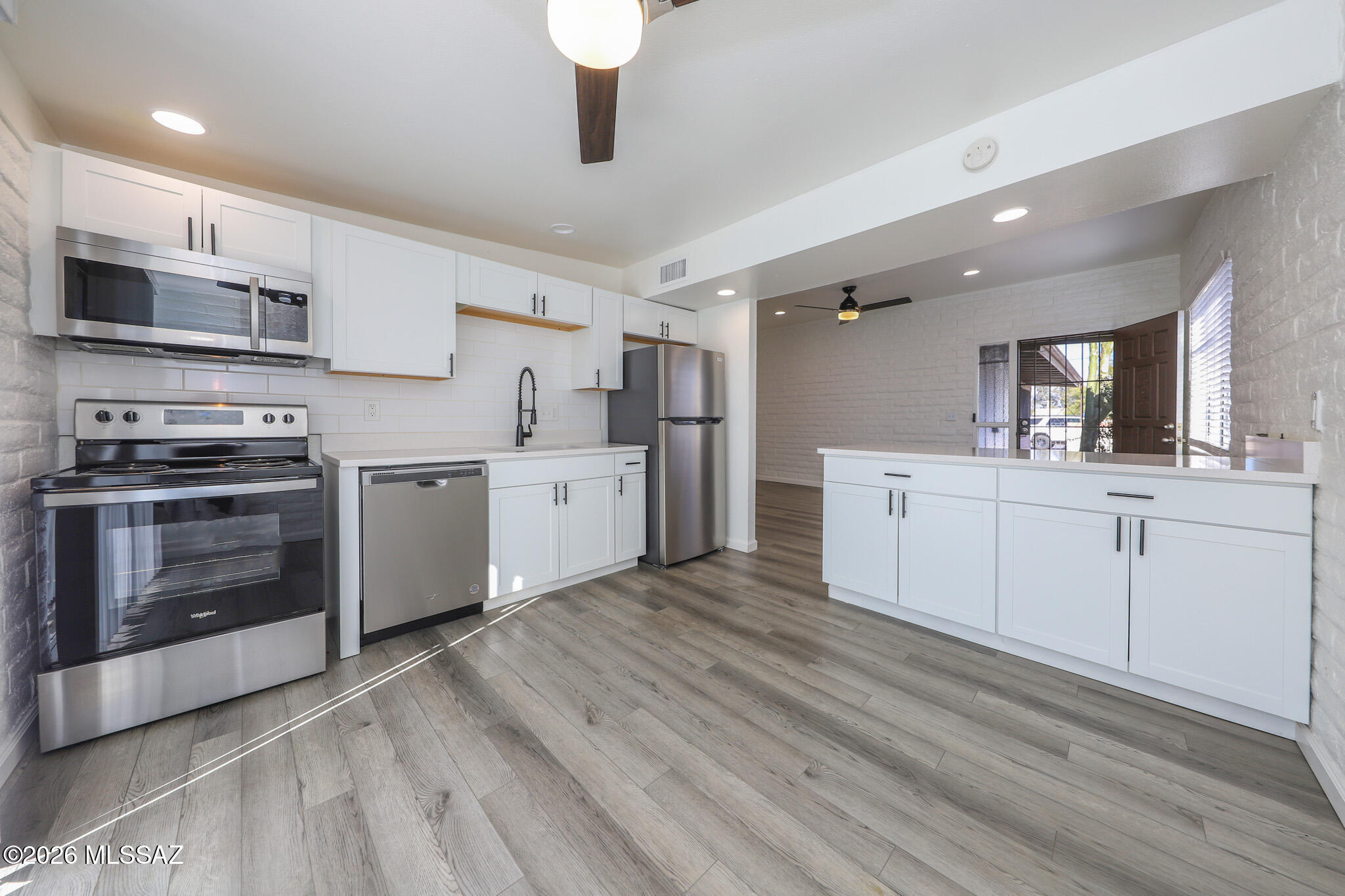 Welcome home to this beautifully remodeled 972 sq ft townhouse in the heart of central Tucson. This contemporary rental features two spacious bedrooms and two fully updated bathrooms, each enhanced with modern fixtures and stylish tile work. The recently renovated interior showcases a sleek, modern aesthetic with abundant natural light throughout. The kitchen is a standout, offering quartz countertops, newer stainless steel appliances, and ample space for cooking and entertaining. A comfortable open living area flows seamlessly to a huge private backyard—perfect for relaxing, gardening, or hosting guests. Additional highlights include a two-car carport with extra storage. Conveniently located near shopping, dining, and major corridors, this home offers comfort, style, and functionality i