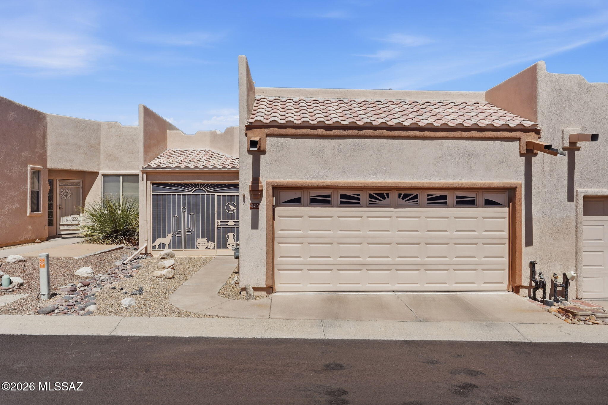 Discover the ease of Southwest living in this beautifully maintained, fully furnished 2-bedroom townhome in one of Green Valley's most sought-after low-maintenance communities. Offering 1,283 sq. ft. of light-filled living space, this move-in-ready home is ideal for seasonal residents, full-time living, or as a turnkey investment opportunity.

Designed for effortless desert living, the spacious living and dining area creates an inviting setting for everyday comfort and easy entertaining, with seamless flow to both the bright kitchen and the home's inviting outdoor spaces. Step outside to the private enclosed front patio, perfect for morning coffee, or unwind on the covered rear patio with a roll-down privacy screen, creating a shaded retreat for relaxing year-round. The bright kitchen features Merillat cabinetry, rollout shelving, pantry storage, and a newer LG range (2025), along with an energy-efficient refrigerator, microwave, dishwasher, and included small appliances. The spacious primary suite offers an en-suite bath and large walk-in closet, while the guest bedroom and adjacent bath provide flexibility for visitors, seasonal guests, or a home office.

Additional highlights include in-unit laundry with newer HE washer and dryer, abundant storage, and an attached garage complete with a myQ smart opener, shelving, workbench, golf storage, and laser parking assist.

Residents enjoy a vibrant clubhouse lifestyle with a lap pool, spa, library, shuffleboard, dog park, and year-round social activities, all conveniently close to Green Valley shopping, dining, and everyday amenities.