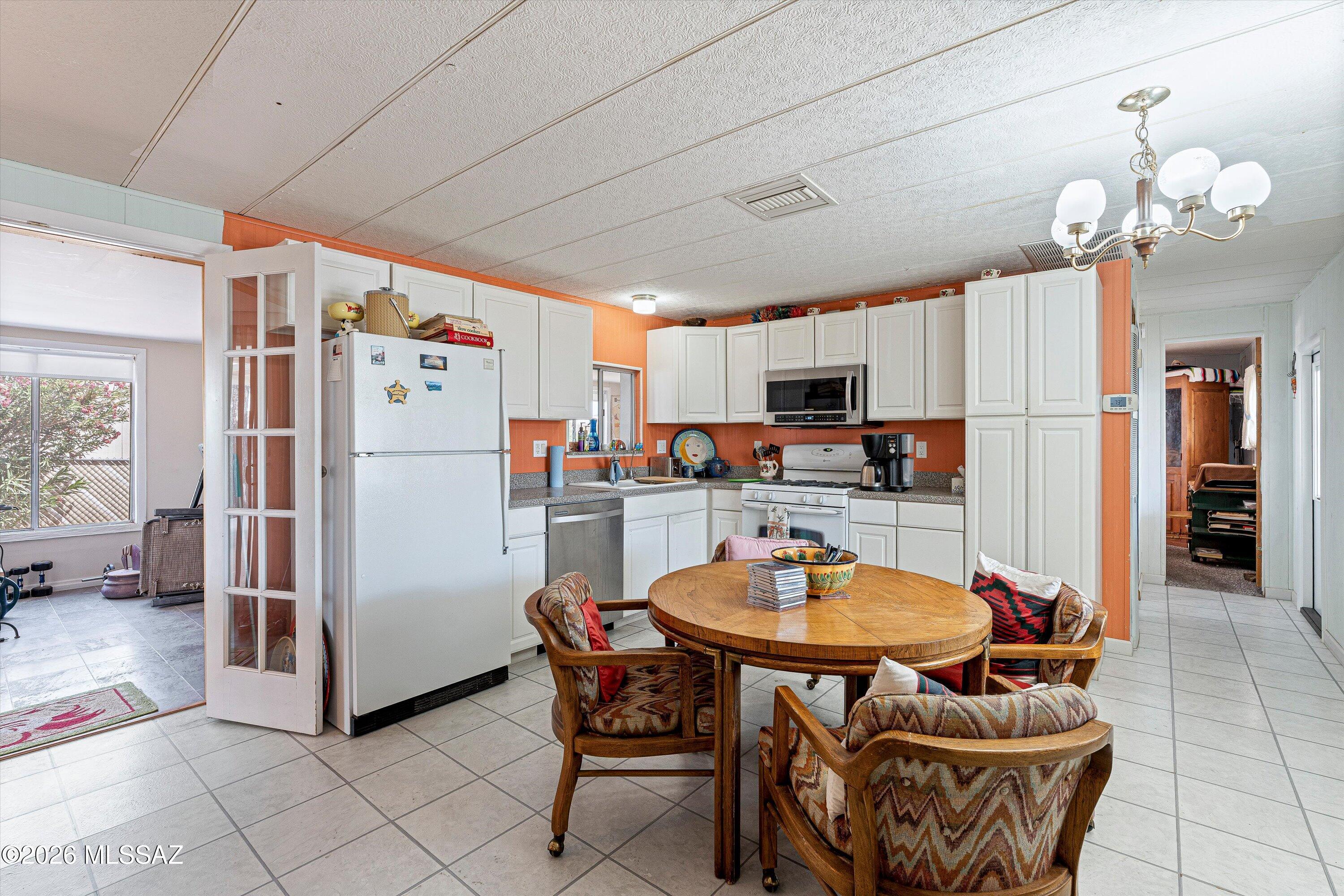 Welcome to this charming, move-in ready 2-bedroom gem nestled in the sought-after Tucson Estates 55+ community! This turn-key home comes fully furnished and packed with upgrades throughout, just bring your suitcase! A thoughtfully designed addition significantly expands the living area, offering the space and comfort you've been looking for whether you're here year-round or enjoying the warm Arizona winters. 
Life at Tucson Estates is truly resort-style living. Stay active and social with access to a heated indoor pool, two outdoor pools, a golf course and driving range, plus vibrant community amenities including a library, conference rooms, and a dance hall. There's always something to do and neighbors to enjoy it with.
Whether you're looking for a full-time residence or the perfect seasonal retreat, this home checks every box. Comfort, convenience, and community -- all in one!